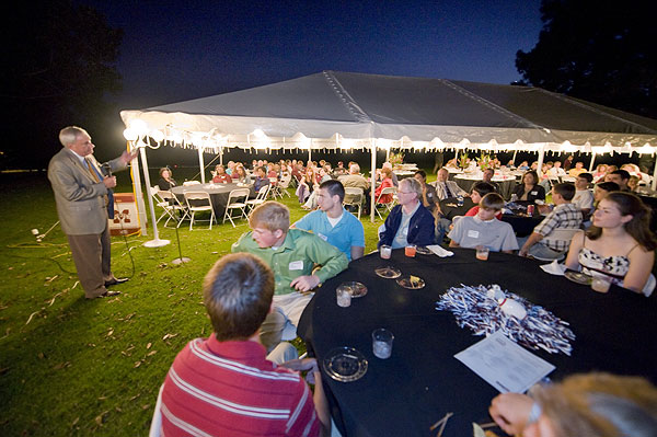 Roy Ruby speaks to prospective students at president's home