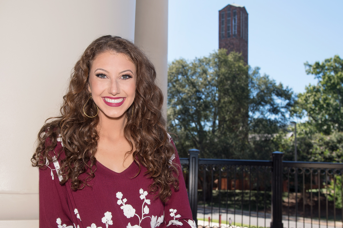 Hannah Duke, pictured at MSU&amp;amp;#039;s Old Main Academic Center with the Chapel of Memories carillon tower in the distance