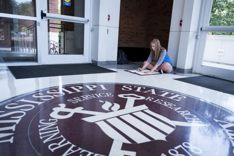 Student Drawing Near Union Seal