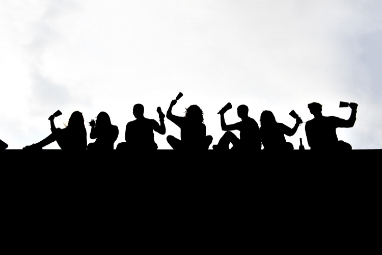 Orientation Leaders Silhouettes With Cowbells