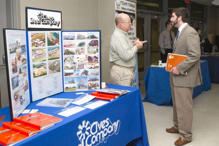 Ryan Gaddy talks with Cives Steel Co. representative and MSU alumni Robert Mathews at Career Days.