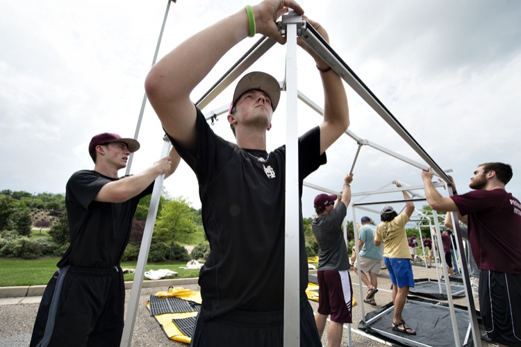 Student volunteers help set up tornado relief