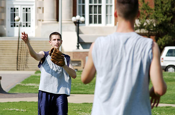 Tossing baseball on Drill Field