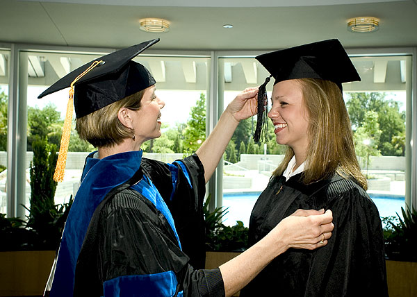 Sandy & Andrea Slocum in graduation gowns
