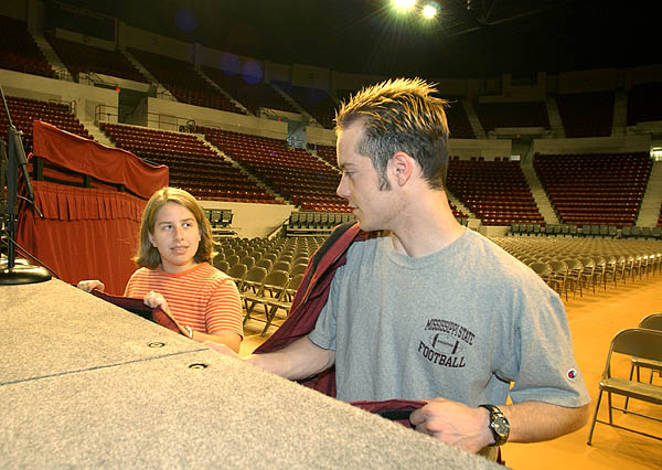 Putting on stage skirt for graduation