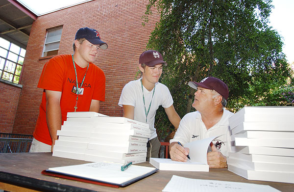 Coach Polk signs books at baseball camp