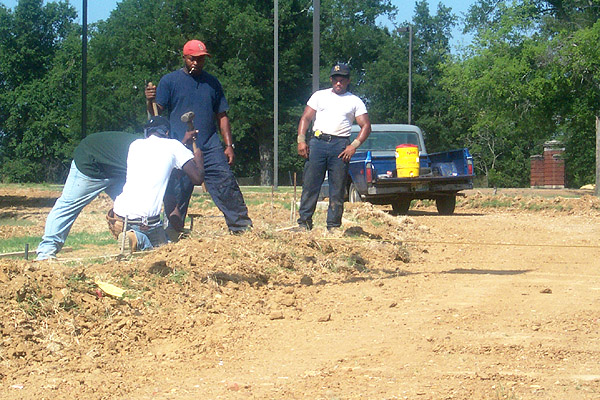 Workers prepare to pour concrete for bike path