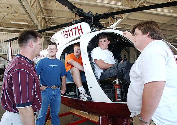 Quest engineering students look at Raspet helicopter