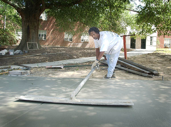 Pouring sidewalk in front of Freeman Hall