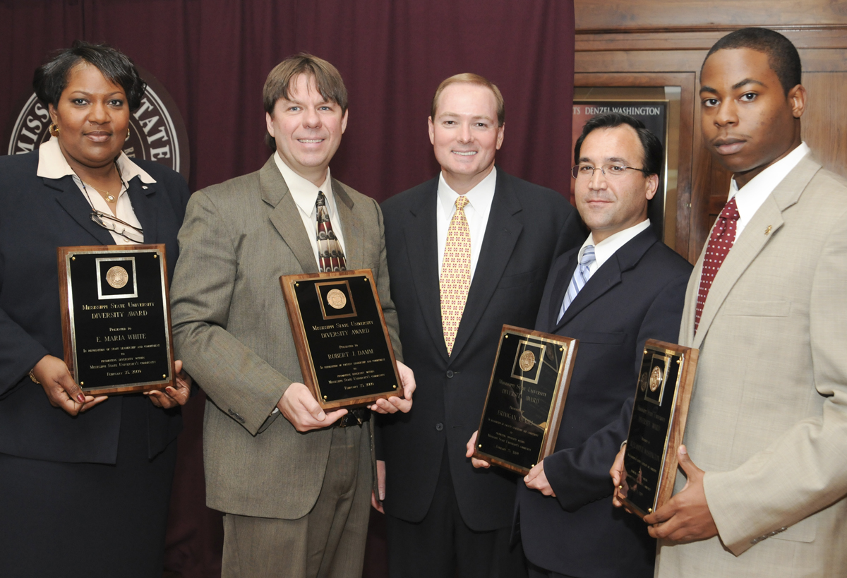 MSU President Mark Keenum (center) congratulates 2009 Diversity Award winners (from left) Maria White, Robert Damm, Erdogan Memili, and Alexander Washington. MSU President Mark Keenum (center) congratulates 2009 Diversity Award winners (from left) Maria White, Robert Damm, Erdogan Memili, and Alexander Washington.