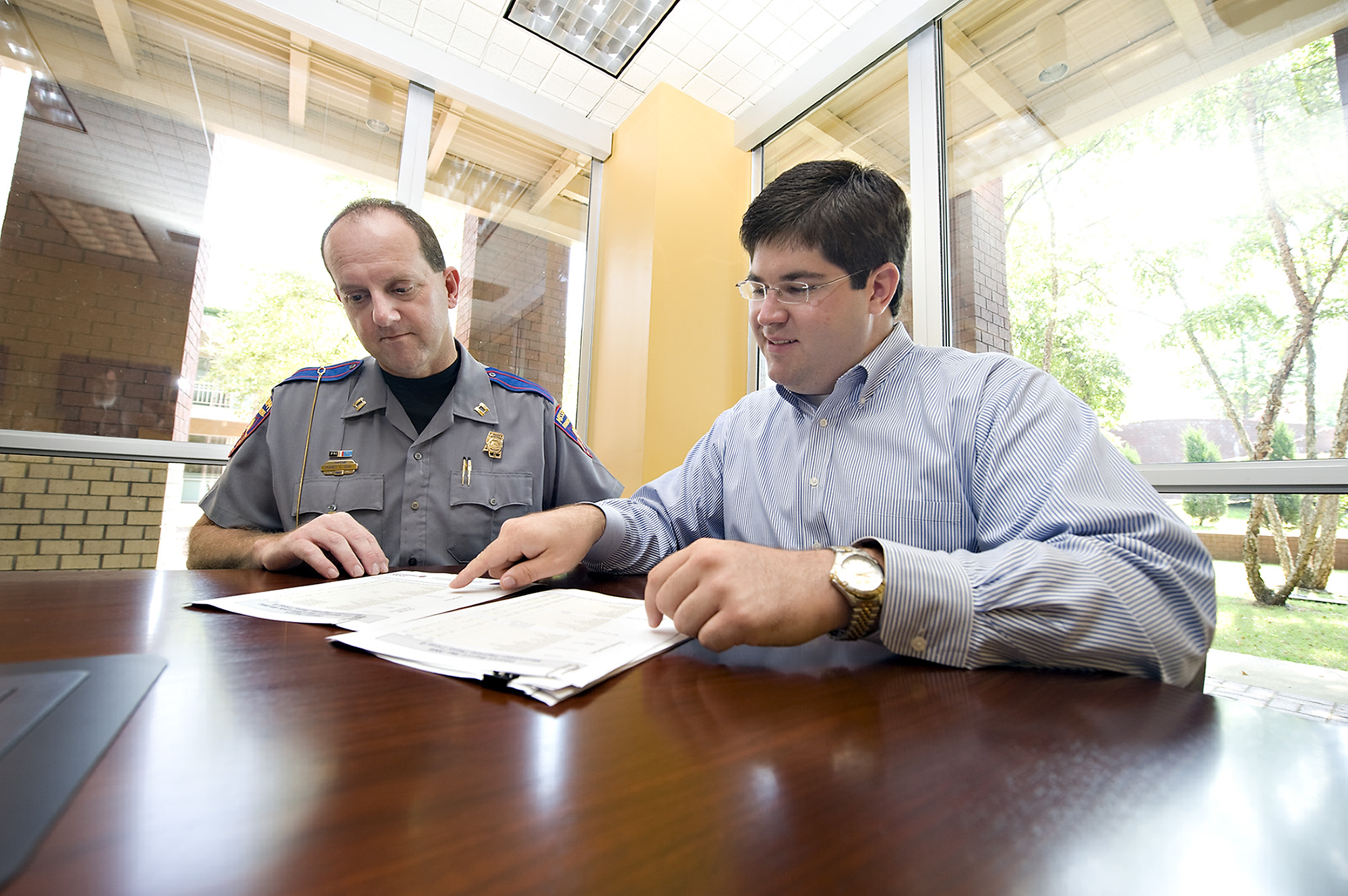 Capt. Randy Ginn, left, of the Mississippi Highway Patrol in Starkville and research associate at Mississippi State University's Social Science Research Center Lee Weiskopf review reports produced by the research center based on data from the state agency. As of July, all highway patrol districts in the state use the upgraded reporting system. Capt. Randy Ginn, left, of the Mississippi Highway Patrol in Starkville and research associate at Mississippi State University's Social Science Research Center Lee Weiskopf review reports produced by the research center based on data from the state agency. As of July, all highway patrol districts in the state use the upgraded reporting system.