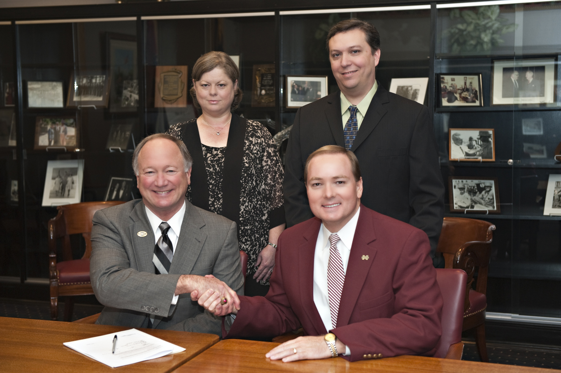Presidents Rick Young of EMCC (l) and Mark Keenum of MSU recently marked the formal participation of the community college in the Golden Triangle Regional Library Consortium. EMCC's Donna Ballard and MSU's Stephen Cunetto, library staff members at the respective institutions, also were part of the program. Presidents Rick Young of EMCC (l) and Mark Keenum of MSU recently marked the formal participation of the community college in the Golden Triangle Regional Library Consortium. EMCC's Donna Ballard and MSU's Stephen Cunetto, library staff members at the respective institutions, also were part of the program.