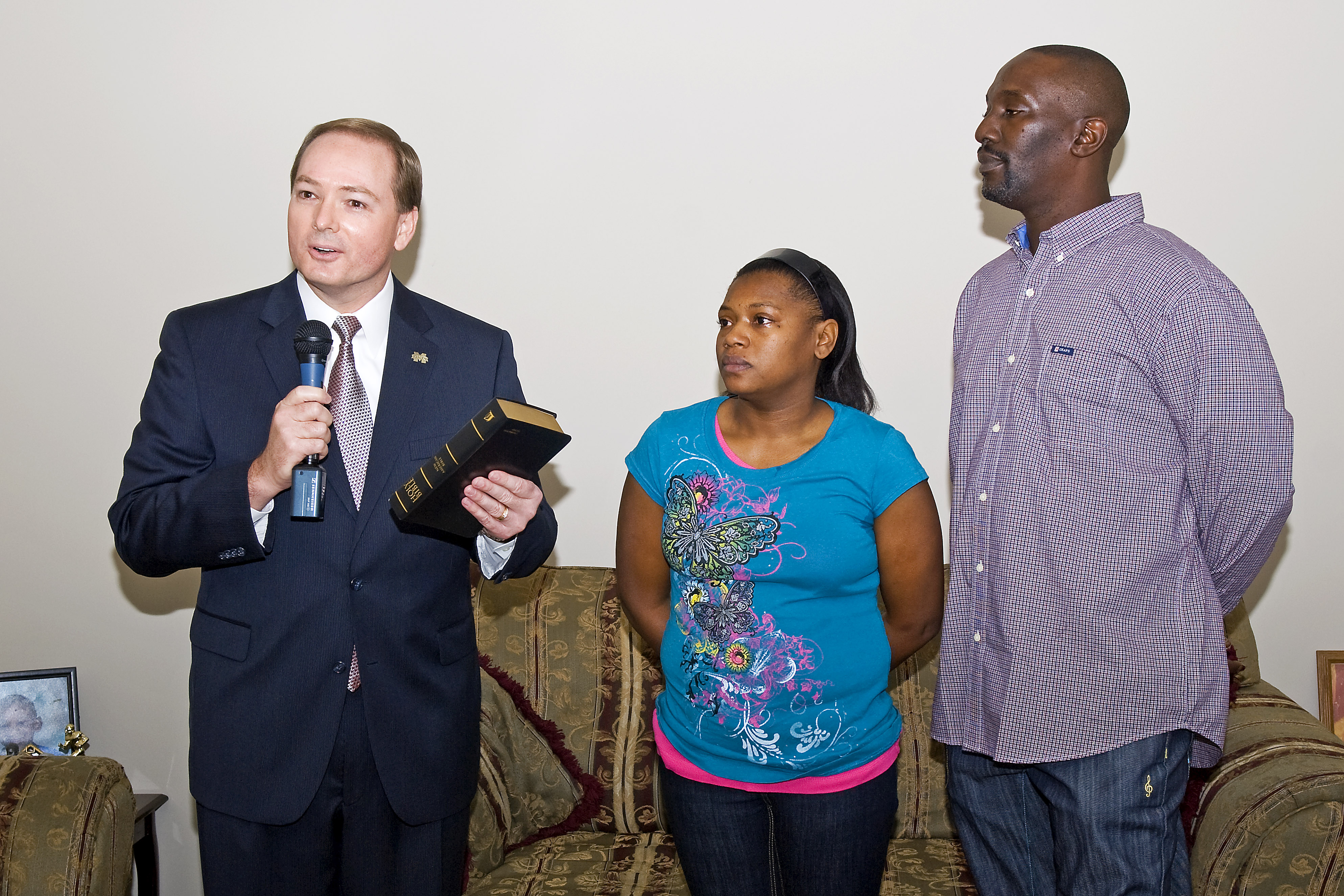 MSU President Keenum presents a bible to new homeowners Sabrina Randle and Rufus Harvey. MSU President Keenum presents a bible to new homeowners Sabrina Randle and Rufus Harvey.