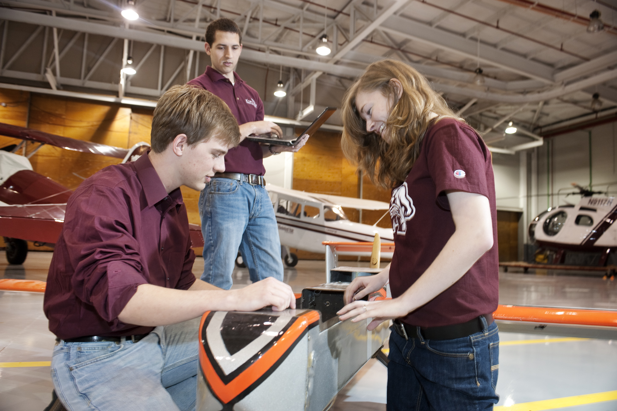 Jeffrey Morris (l), Christopher Edwards and Rebecca Owens of Mississippi State's Team Xipiter check out their winning radio-controlled aircraft. Jeffrey Morris (l), Christopher Edwards and Rebecca Owens of Mississippi State's Team Xipiter check out their winning radio-controlled aircraft.