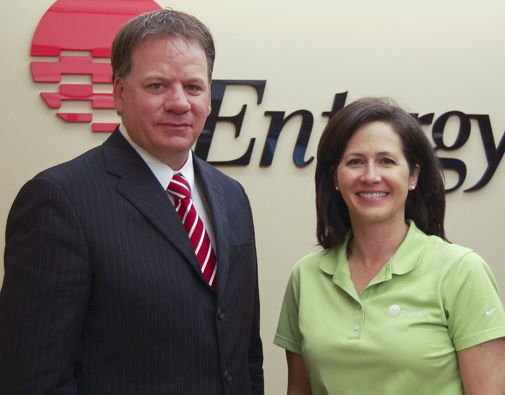 Jack McCarty, executive director of the Mississippi State University Foundation, accepts a check from Liz Brister, Entergy Mississippi's manager of external affairs, for support of Economy Watch, a College of Business magazine. Jack McCarty, executive director of the Mississippi State University Foundation, accepts a check from Liz Brister, Entergy Mississippi's manager of external affairs, for support of Economy Watch, a College of Business magazine.