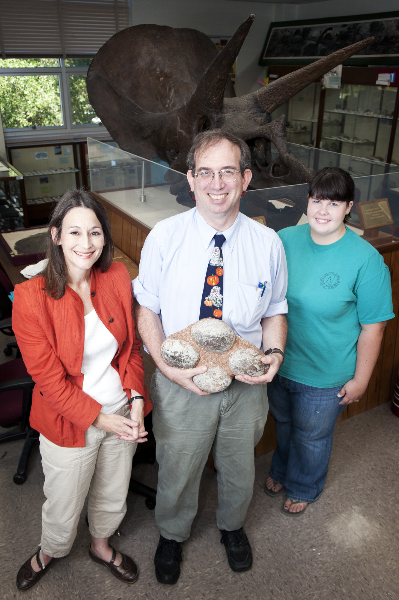 Doctoral student John Paul Jones (c) holds dinosaur eggs he discovered that will be on display Wednesday during "Fossil Extravaganza 2011" at MSU's Dunn-Seiler Museum. With him are museum director Renee Clary (l) and student worker Jessica Kelly of Pontotoc. Doctoral student John Paul Jones (c) holds dinosaur eggs he discovered that will be on display Wednesday during "Fossil Extravaganza 2011" at MSU's Dunn-Seiler Museum. With him are museum director Renee Clary (l) and student worker Jessica Kelly of Pontotoc.