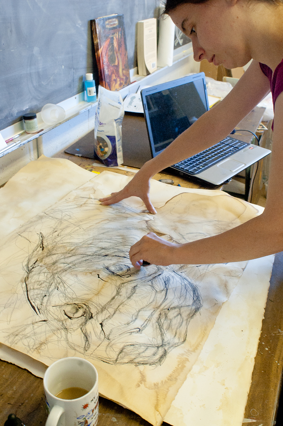 Senior art major Kathleen O'Hear of Starkville works on her series of field studies. Senior art major Kathleen O'Hear of Starkville works on her series of field studies.