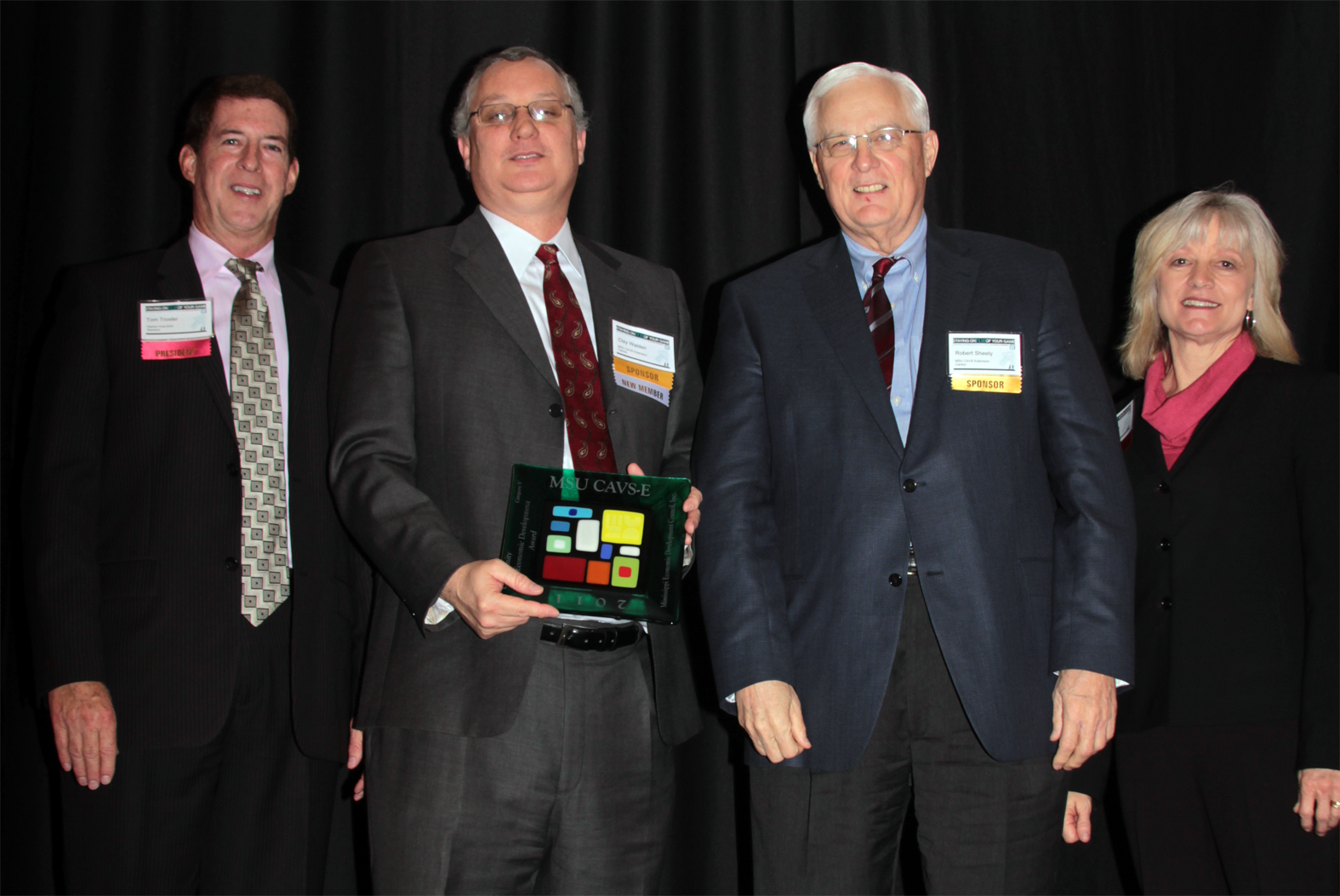 MSU's Clay Walden and Robert Sheely (center left and right, respectively) accept the Community Economic Development Award from MEDC board president Tom Troxler (left) and MEDC executive director Carol Hardwick. Troxler is executive director of the Rankin First Economic Development Authority. MSU's Clay Walden and Robert Sheely (center left and right, respectively) accept the Community Economic Development Award from MEDC board president Tom Troxler (left) and MEDC executive director Carol Hardwick. Troxler is executive director of the Rankin First Economic Development Authority.