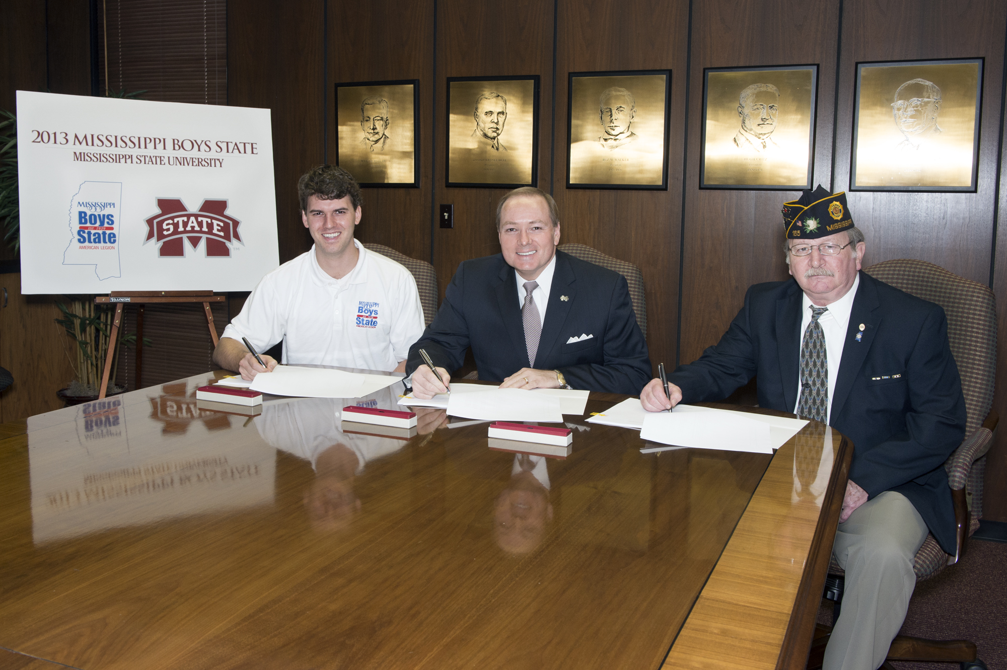 Mississippi State University has been selected as the 2013-15 host campus for Mississippi's American Legion Boys State program. Sponsored by the American Legion, Boys State is the nation's premier program for teaching how government works while developing leadership skills and an appreciation for the rights and responsibilities of citizenship. Boys State Director Neal Boone, left, MSU President Mark E. Keenum, center, and Boys State Chairman Donald Cabrol of the American Legion signed the three-year agreement Wednesday morning. About 350 young men from across the state will gather on the MSU Starkville Campus this summer to learn about state and local government and the electoral process. Mississippi State University has been selected as the 2013-15 host campus for Mississippi's American Legion Boys State program. Sponsored by the American Legion, Boys State is the nation's premier program for teaching how government works while developing leadership skills and an appreciation for the rights and responsibilities of citizenship. Boys State Director Neal Boone, left, MSU President Mark E. Keenum, center, and Boys State Chairman Donald Cabrol of the American Legion signed the three-year agreement Wednesday morning. About 350 young men from across the state will gather on the MSU Starkville Campus this summer to learn about state and local government and the electoral process.