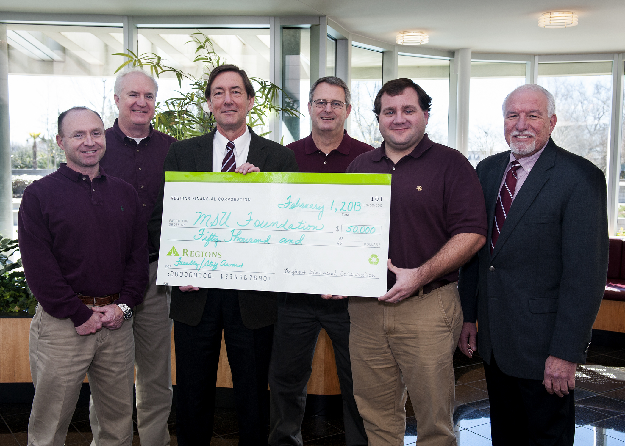 From left, Alan Sims, Regions senior vice president for agribusiness; George Jarman, Regions Greenwood/Delta city president; Gregory A. Bohach, MSU DAFVM vice president; Samuel Slaughter, Regions Starkville city president; Walt Stephens, Regions community bank and agriculture relations manager; and Bill Herndon, MSU DAFVM associate vice president, celebrate a $50,000 contribution to support major faculty awards in MSU's Division of Agriculture, Forestry and Veterinary Medicine. From left, Alan Sims, Regions senior vice president for agribusiness; George Jarman, Regions Greenwood/Delta city president; Gregory A. Bohach, MSU DAFVM vice president; Samuel Slaughter, Regions Starkville city president; Walt Stephens, Regions community bank and agriculture relations manager; and Bill Herndon, MSU DAFVM associate vice president, celebrate a $50,000 contribution to support major faculty awards in MSU's Division of Agriculture, Forestry and Veterinary Medicine.