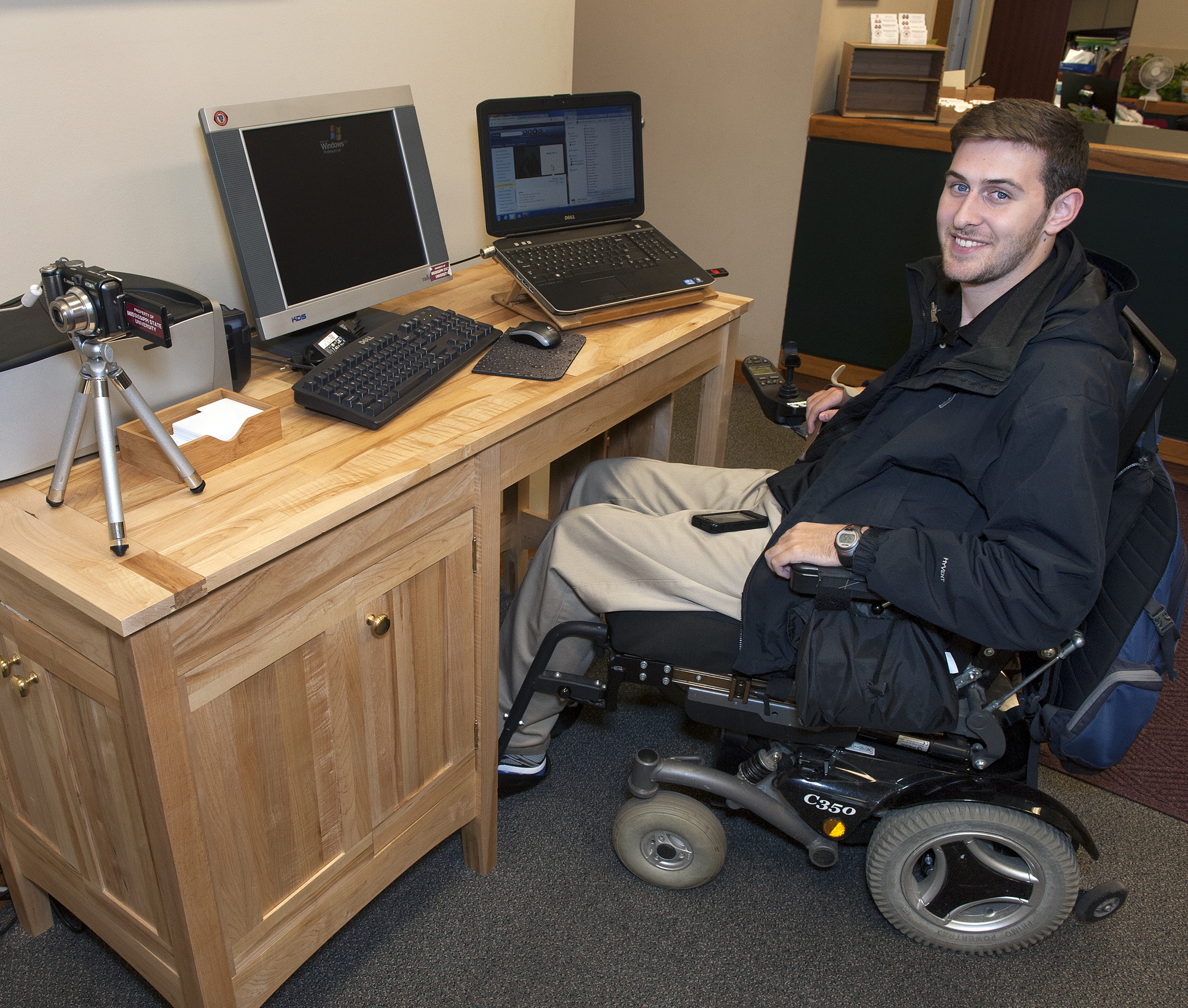 Will Graves, a junior history major at Mississippi State University, shows off the desk senior Morgan Welch designed and built for him. Will Graves, a junior history major at Mississippi State University, shows off the desk senior Morgan Welch designed and built for him.