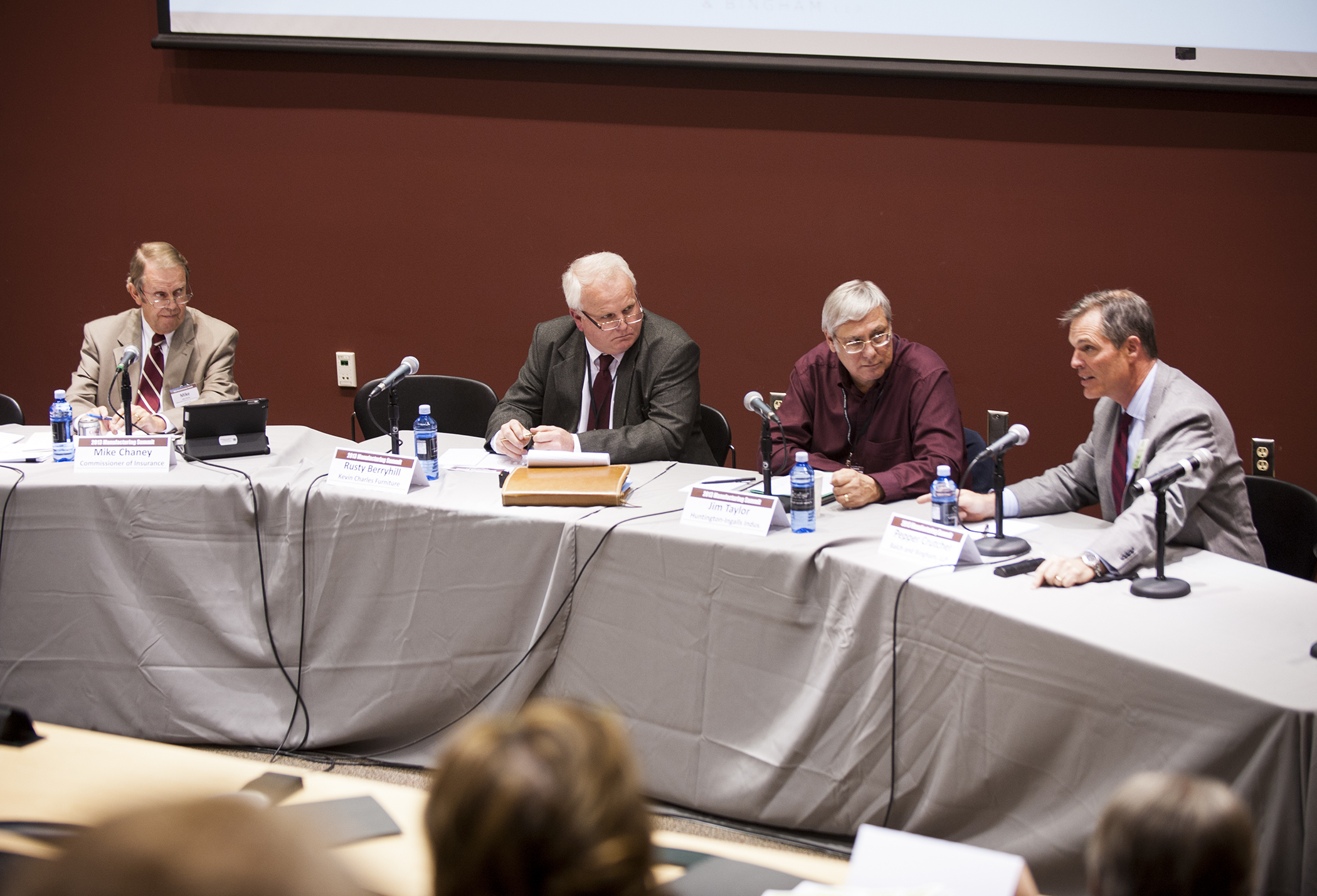 Panelists Mike Chaney, from left, Rusty Berryhill, and Jim Taylor, look on as Pepper Crutcher discusses implications of the Affordable Care Act for manufacturers and other state businesses.</p><br />
<p> Panelists Mike Chaney, from left, Rusty Berryhill, and Jim Taylor, look on as Pepper Crutcher discusses implications of the Affordable Care Act for manufacturers and other state businesses.</p><br />
<p>