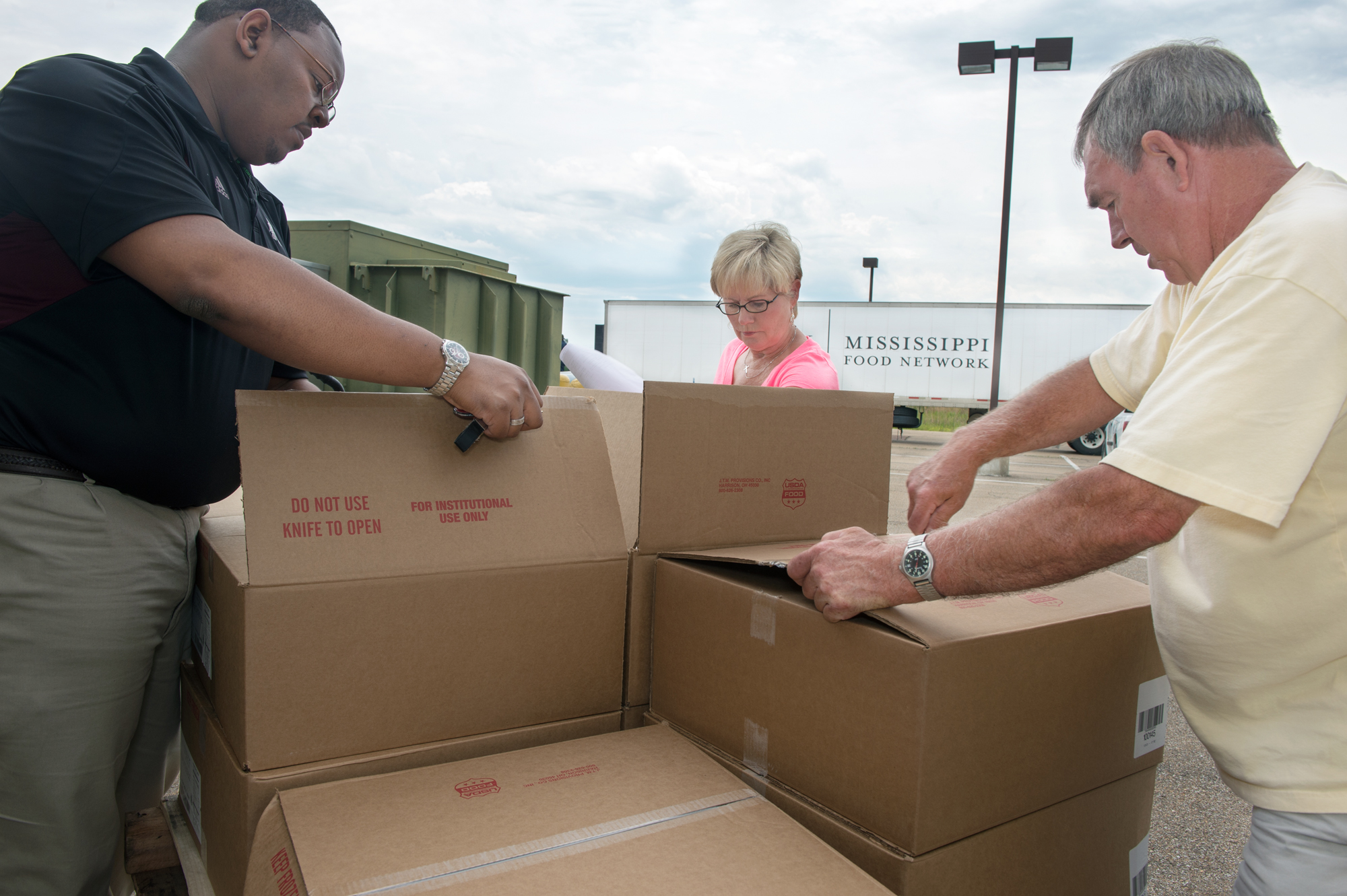MSU graduate student Stedmond Ware of Greenwood, left, and Johnnie Armstrong and Buddy Downer, both of Starkville's Pinelake Church, unload food from a shipment that has been delivered from the Mississippi Food Network. The items help stock the shelves at the church's food pantry and help feed those in need in the local community, including MSU students who qualify to participate. MSU graduate student Stedmond Ware of Greenwood, left, and Johnnie Armstrong and Buddy Downer, both of Starkville's Pinelake Church, unload food from a shipment that has been delivered from the Mississippi Food Network. The items help stock the shelves at the church's food pantry and help feed those in need in the local community, including MSU students who qualify to participate.