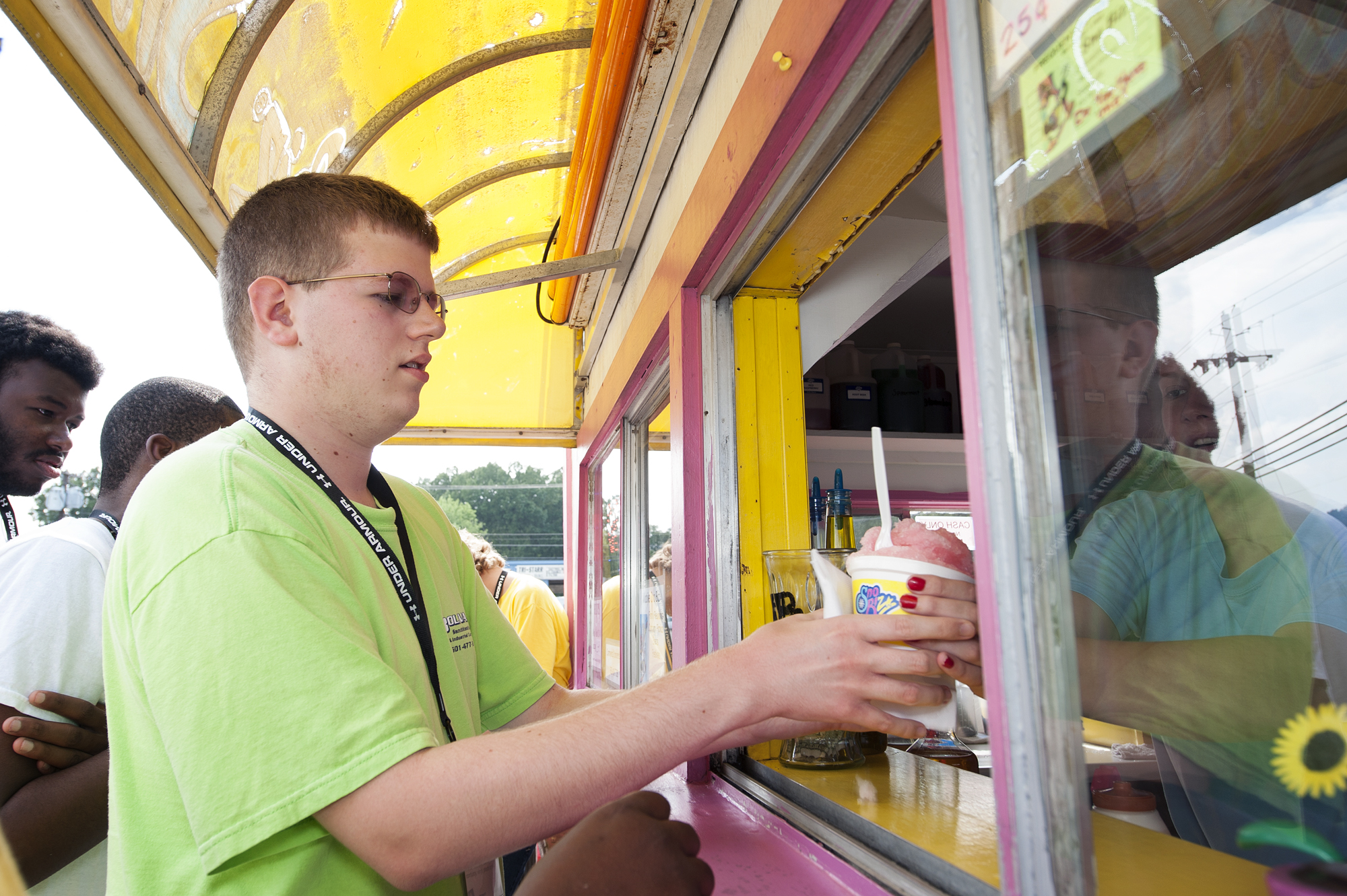 Joshua Smith of Biggersville purchases a snow-cone during Camp Jigsaw activities. Smith, who has an autism spectrum disorder, has participated in the camp at Mississippi State University since it began four years ago. He said while social skills can be difficult, he has learned a lot about controlling behaviors at camp and he has enjoyed the various activities, such as swimming. Joshua Smith of Biggersville purchases a snow-cone during Camp Jigsaw activities. Smith, who has an autism spectrum disorder, has participated in the camp at Mississippi State University since it began four years ago. He said while social skills can be difficult, he has learned a lot about controlling behaviors at camp and he has enjoyed the various activities, such as swimming.