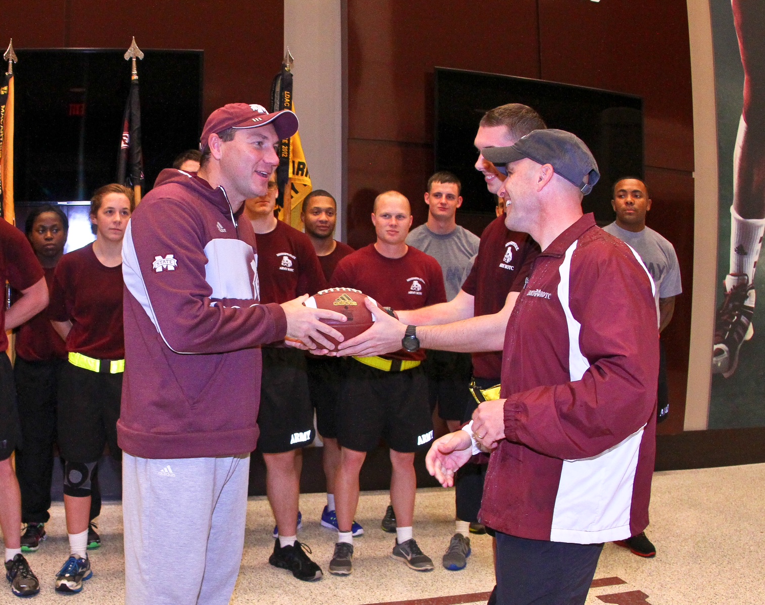 MSU Head Football Coach Dan Mullen receives the game ball from Bulldog Army ROTC cadets at the conclusion of Egg Bowl Run Monday. MSU Head Football Coach Dan Mullen receives the game ball from Bulldog Army ROTC cadets at the conclusion of Egg Bowl Run Monday.
