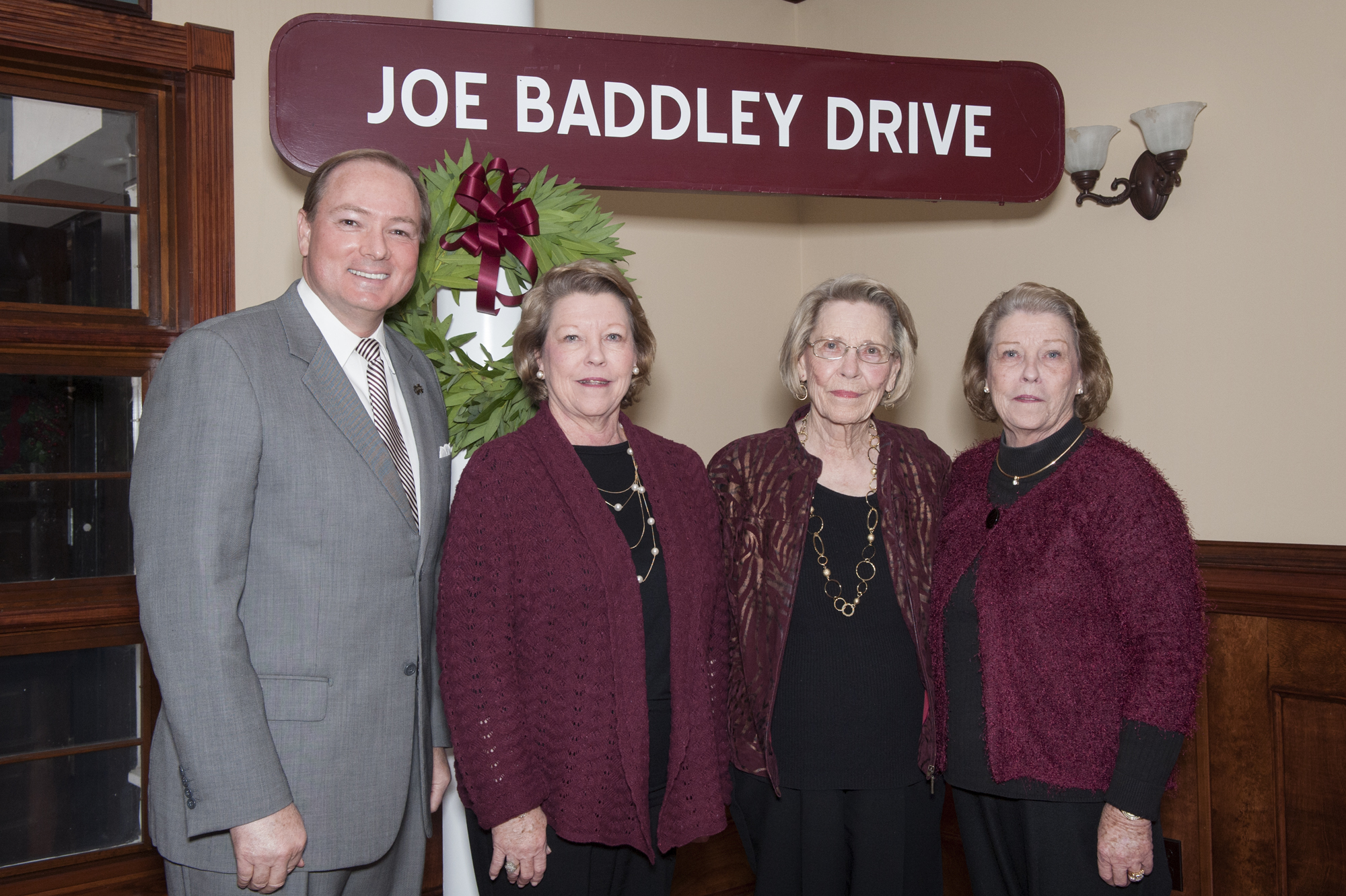 During the Tuesday rededication ceremony at the MSU enology laboratory,<br /><br />
President Mark E. Keenum presented former signage marking Joe Baddley Drive to members of the Baddley family. They include (l-r) Jean Baddley Cox, Connie Baddley, and Joan Baddley Ishee.<br /><br />
During the Tuesday rededication ceremony at the MSU enology laboratory,<br /><br />
President Mark E. Keenum presented former signage marking Joe Baddley Drive to members of the Baddley family. They include (l-r) Jean Baddley Cox, Connie Baddley, and Joan Baddley Ishee.<br /><br />