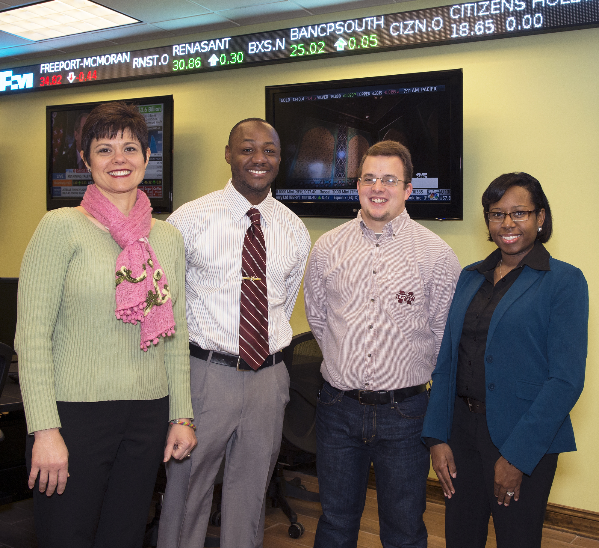 During the fall 2013 semester, Mississippi State teacher technology education students taught The Stock Market Game to members of Starkville's Boys & Girls Club of the Golden Triangle. From left are Becky Smith, MSU agricultural economics assistant extension professor; Lucas Davenport, Boys & Girls Club director; Douglas "Cole" Bostick, TTE senior; and Pamela Scott-Bracey, TTE assistant professor. During the fall 2013 semester, Mississippi State teacher technology education students taught The Stock Market Game to members of Starkville's Boys & Girls Club of the Golden Triangle. From left are Becky Smith, MSU agricultural economics assistant extension professor; Lucas Davenport, Boys & Girls Club director; Douglas "Cole" Bostick, TTE senior; and Pamela Scott-Bracey, TTE assistant professor.