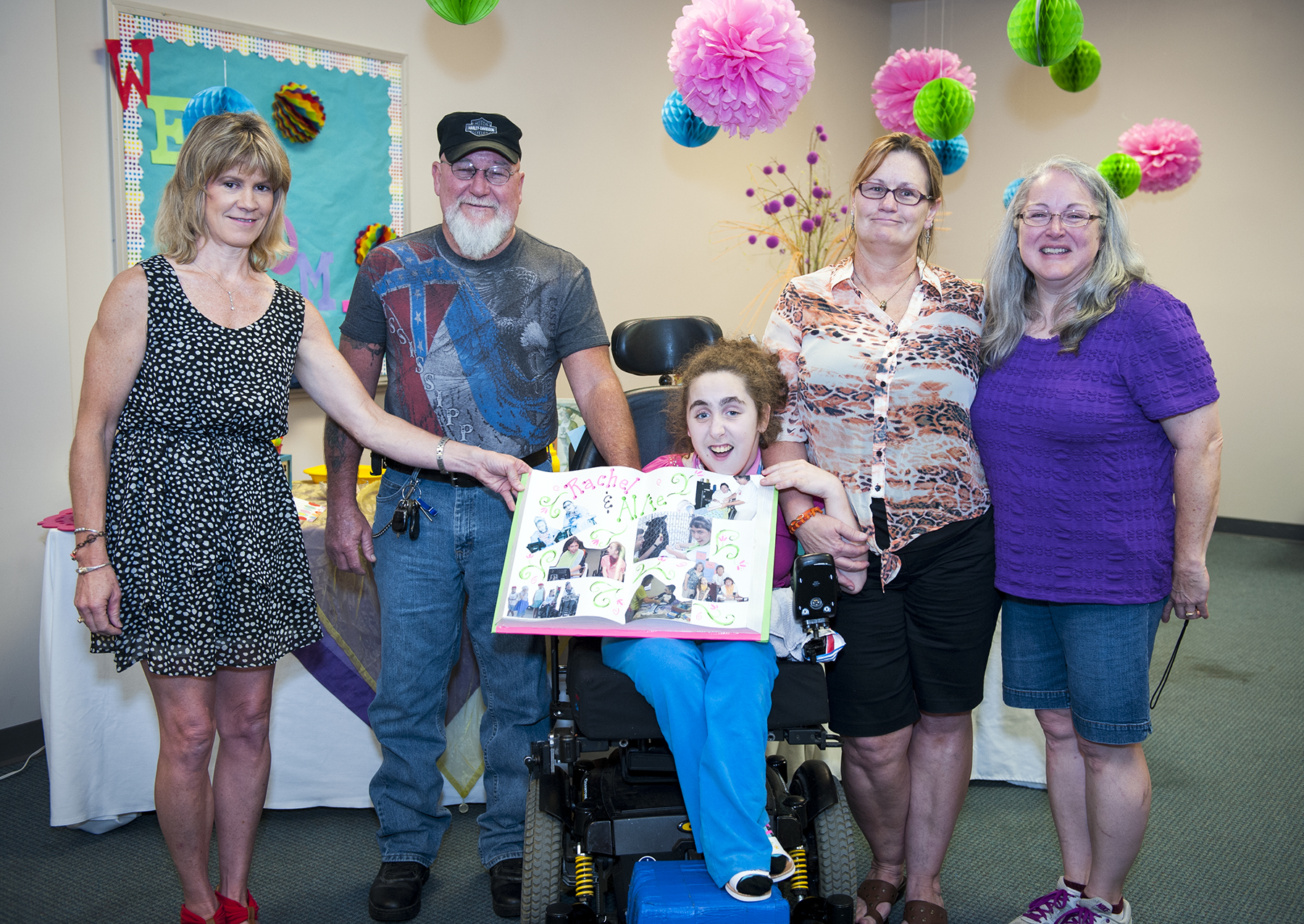 Laurie Craig (far left), speech-language pathologist at MSU's T.K. Martin Center, helps Camp Jabber Jaw participant Rachel Dickey display a special scrapbook as Earl and Sissy Barkley and mother Lisa Dickey (far right) look on. Laurie Craig (far left), speech-language pathologist at MSU's T.K. Martin Center, helps Camp Jabber Jaw participant Rachel Dickey display a special scrapbook as Earl and Sissy Barkley and mother Lisa Dickey (far right) look on.