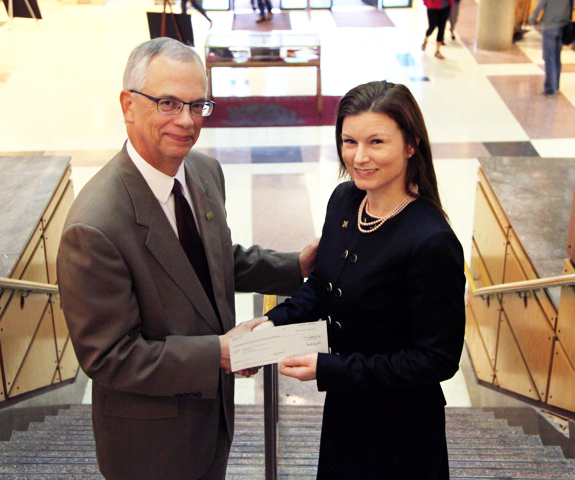 Paula Jean Runge, right, a 2004 mechanical engineering alumna, recently presented a $288,437.25 check to Jerry A. Gilbert, provost and executive vice president, on behalf of the ExxonMobil Foundation. Paula Jean Runge, right, a 2004 mechanical engineering alumna, recently presented a $288,437.25 check to Jerry A. Gilbert, provost and executive vice president, on behalf of the ExxonMobil Foundation.