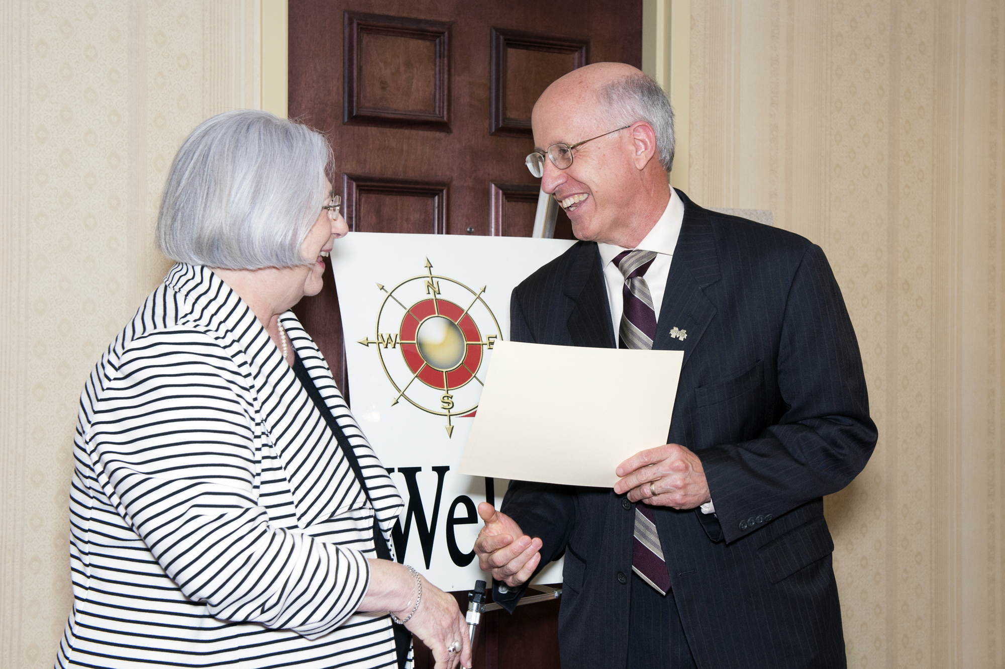 Nellah Taylor, chair of the SOAR board of directors, recently presented a certificate announcing a $10,000 grant for Mississippi State's new rural education research center and learning laboratory. David Shaw, vice president for research and economic development, accepted the award on behalf of the university. Nellah Taylor, chair of the SOAR board of directors, recently presented a certificate announcing a $10,000 grant for Mississippi State's new rural education research center and learning laboratory. David Shaw, vice president for research and economic development, accepted the award on behalf of the university.