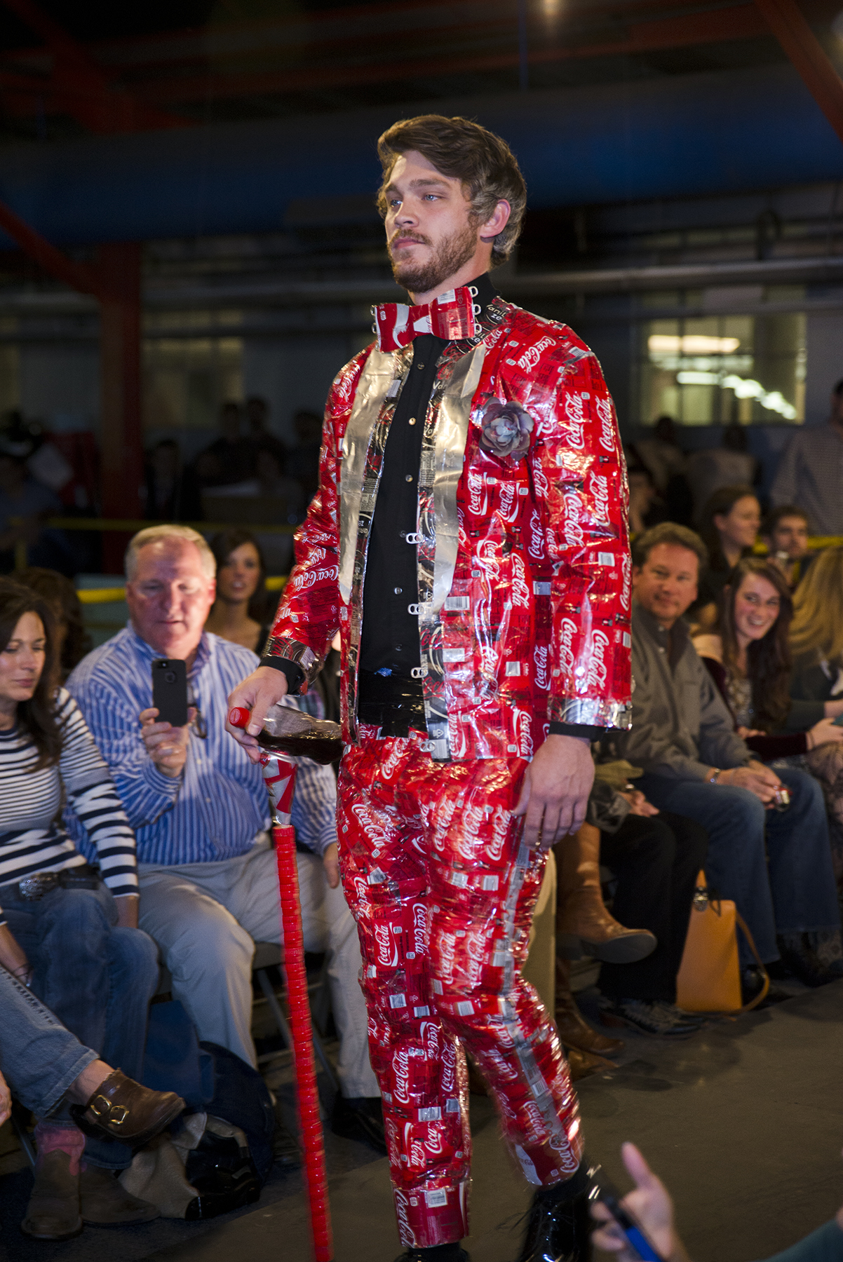 At Mississippi State University's 2013 Trashion Show, senior philosophy major Cameron Moore of Millport, Alabama, modeled a recycled Coca-Cola cans suit, created by senior architecture major Garrett Yelverton of Heidelberg.