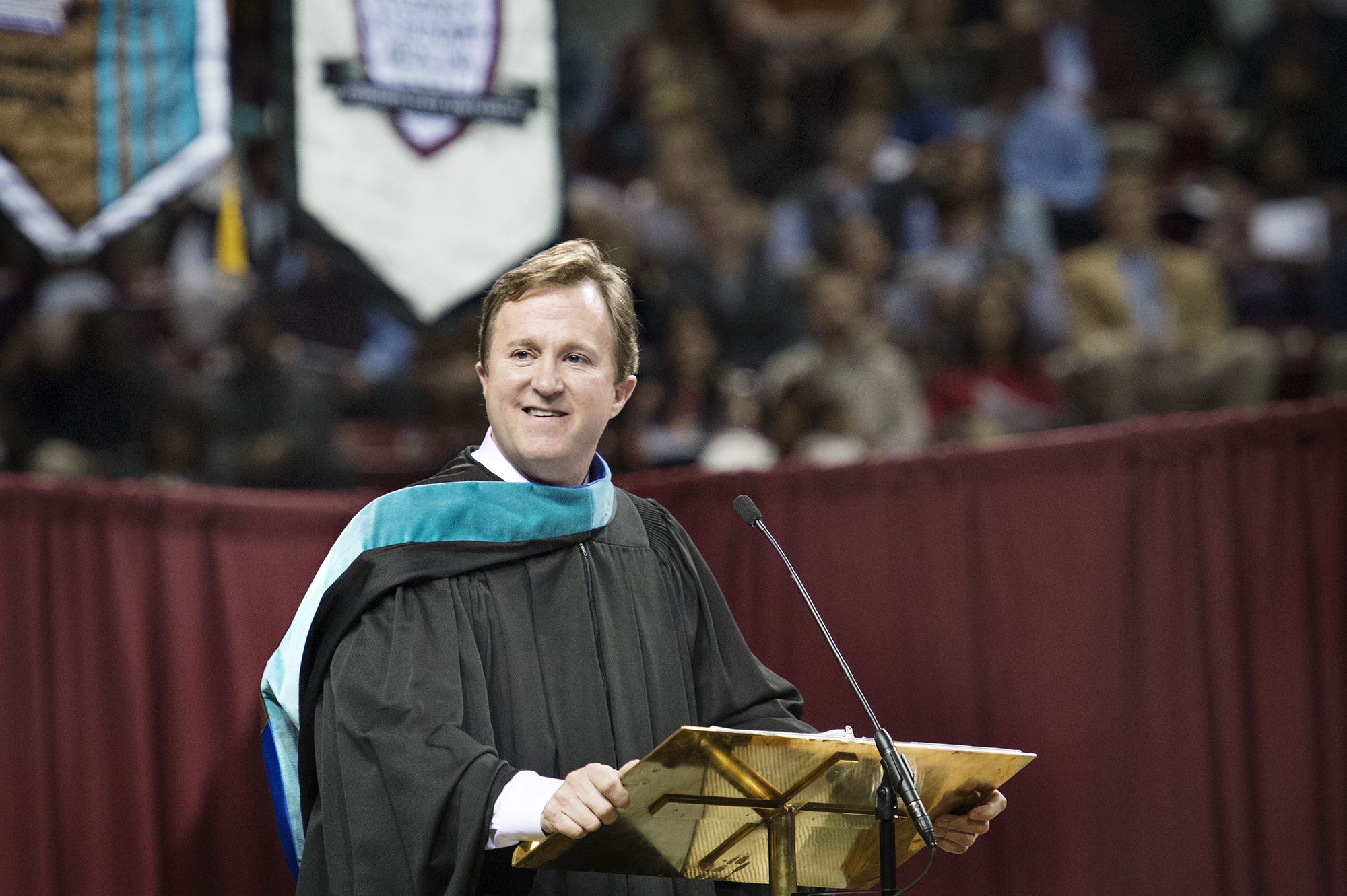 Commencement speaker Haley R. Fisackerly challenges MSU's fall semester graduates to use their skills to strengthen their community during Saturday's graduation activities at Humphrey Coliseum. A 1987 MSU graduate and current president and CEO for Entergy Mississippi, Inc., Fisackerly told his audience "your career success and you and your family's wellbeing are directly tied to the successes and wellbeing of your community."