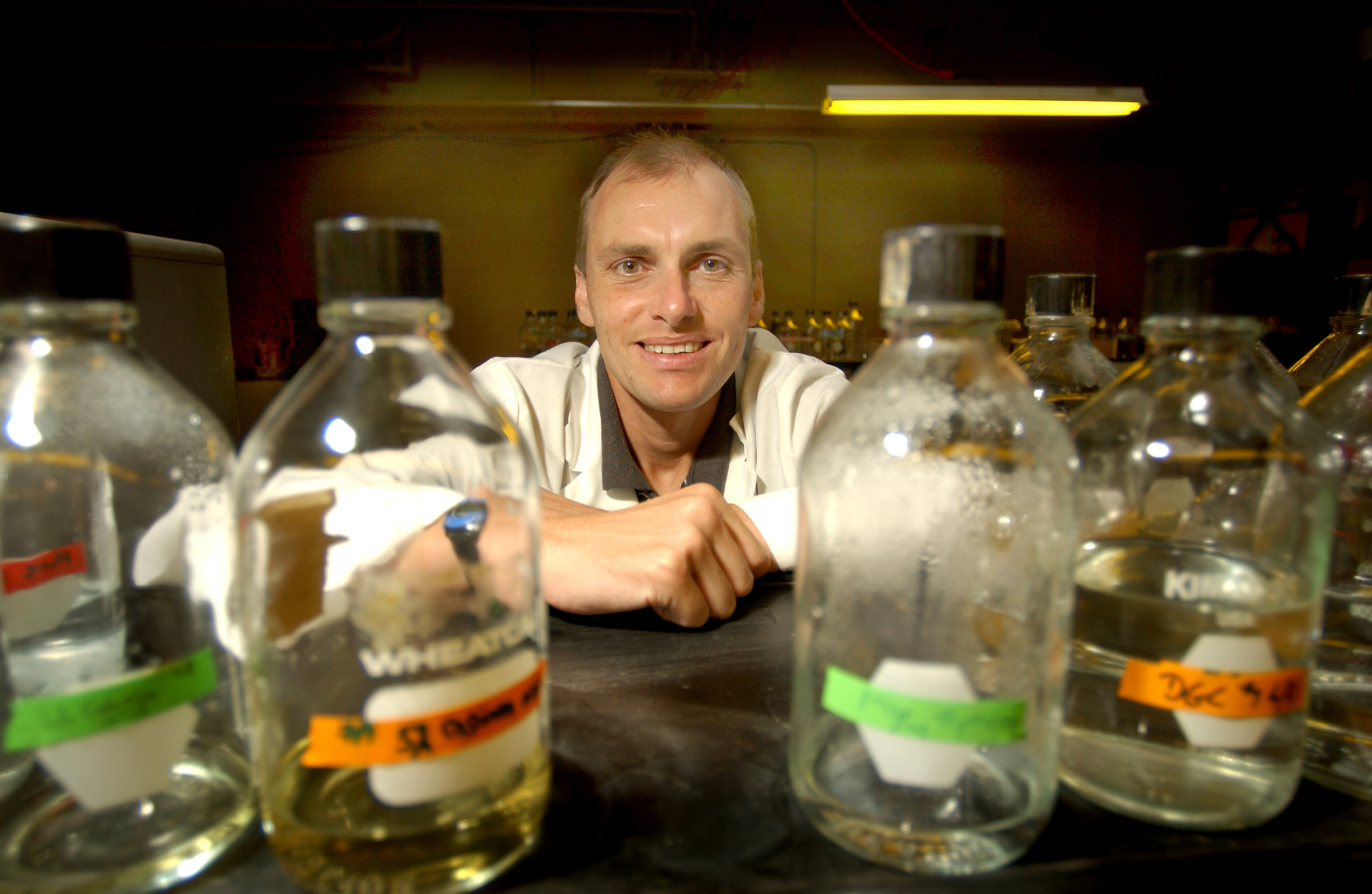 <br /><br />
Mississippi State University biologist Justin Courcelle hopes his scientific study of how damaged human cells repair themselves may one day lead to improved treatments in the fight against cancer and aging. At work in his MSU laboratory, he utilizes yellow lights to control the repair of E. coli bacteria cells damaged by ultraviolet light. The bottles contain media used to grow the bacteria. <br /><br />
Mississippi State University biologist Justin Courcelle hopes his scientific study of how damaged human cells repair themselves may one day lead to improved treatments in the fight against cancer and aging. At work in his MSU laboratory, he utilizes yellow lights to control the repair of E. coli bacteria cells damaged by ultraviolet light. The bottles contain media used to grow the bacteria.
