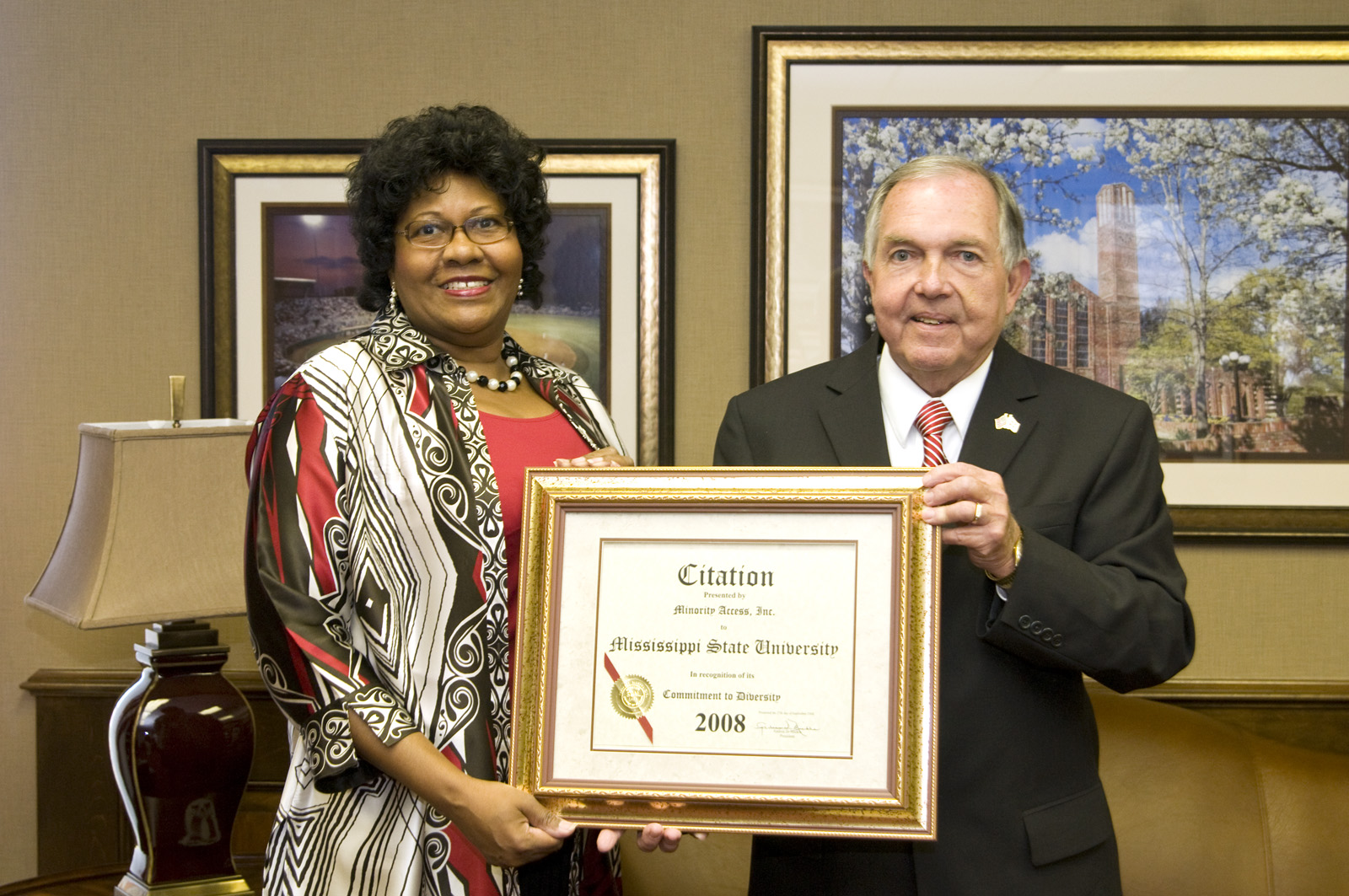 MSU administrator Mary Alexander presents Minority Access Inc. award to Interim President Vance Watson. MSU administrator Mary Alexander presents Minority Access Inc. award to Interim President Vance Watson.