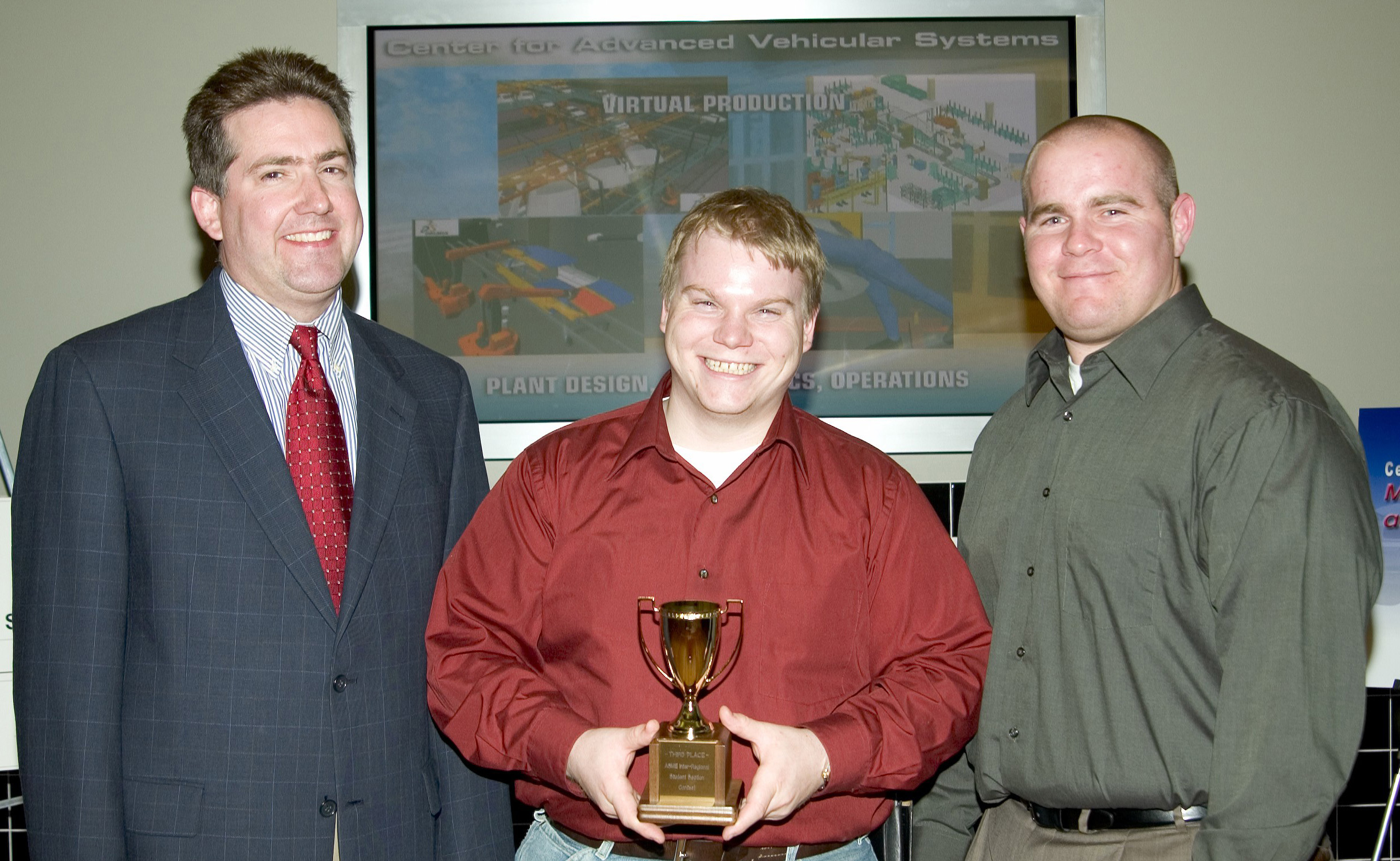 Justin M. Crapps of Florence, Ala., c, and Joseph Matthew "Matt" Jones, r, of Clinton, both senior mechanical engineering majors at Mississippi State, display an award just presented by Kirk Schulz, dean of the Bagley College of Engineering. MSU's student section of the American Society of Mechanical Engineering was a third-place finisher in national competition sponsored by the organization. Jones is the current ASME section president, while Crapps is the immediate past president and current coordinator of the student group's Ingersoll-Rand Inter-regional awards competition. Justin M. Crapps of Florence, Ala., c, and Joseph Matthew "Matt" Jones, r, of Clinton, both senior mechanical engineering majors at Mississippi State, display an award just presented by Kirk Schulz, dean of the Bagley College of Engineering. MSU's student section of the American Society of Mechanical Engineering was a third-place finisher in national competition sponsored by the organization. Jones is the current ASME section president, while Crapps is the immediate past president and current coordinator of the student group's Ingersoll-Rand Inter-regional awards competition.