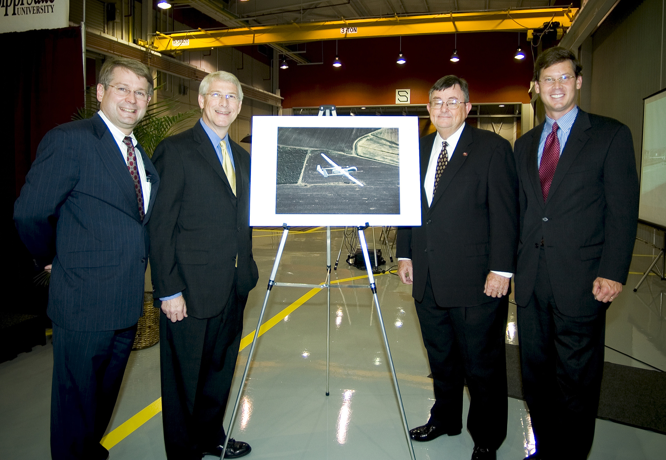 Aurora Flight Sciences President John Langford, Rep. Roger Wicker [R-Miss.], MSU President Charles Lee and Rep. Chip Pickering [R-Miss.] 