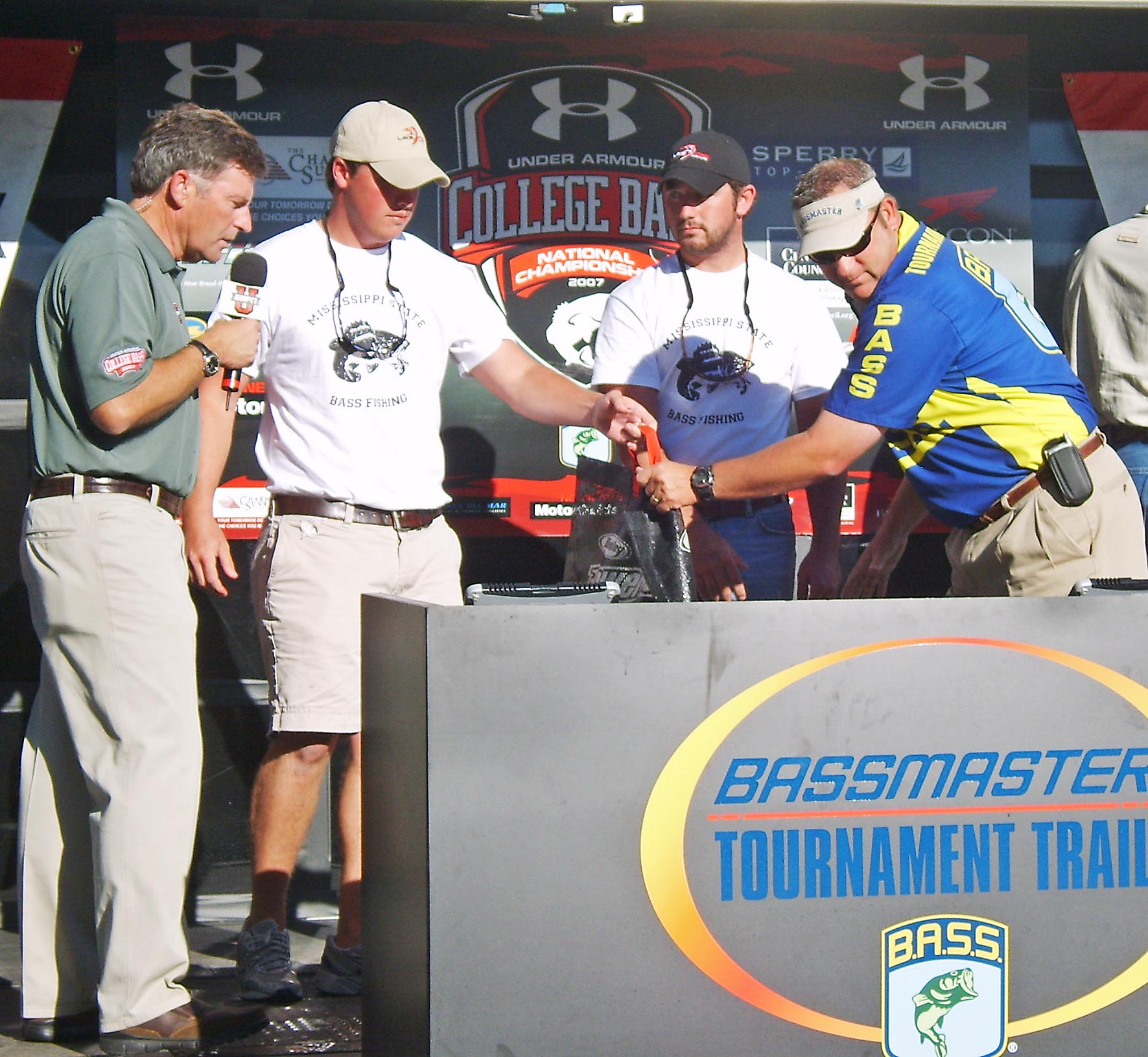 MSU Bass Club anglers Cal Clark (second from left) and Sam Lawrence (second from right) weigh in their catch at the 2007 ESPN Under Armour College Bass National Championship near Little Rock, Ark. MSU Bass Club anglers Cal Clark (second from left) and Sam Lawrence (second from right) weigh in their catch at the 2007 ESPN Under Armour College Bass National Championship near Little Rock, Ark.