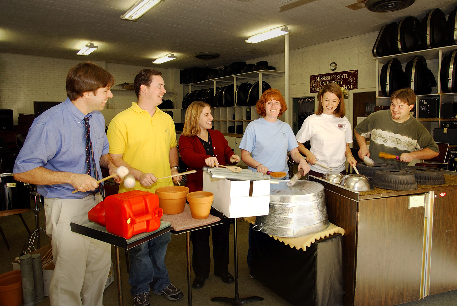 <br /><br />
Bob Damm of music education (left) leads members of the university's Percussion Ensemble rehearsing with a variety of unusual instruments. <br /><br />
Bob Damm of music education (left) leads members of the university's Percussion Ensemble rehearsing with a variety of unusual instruments.
