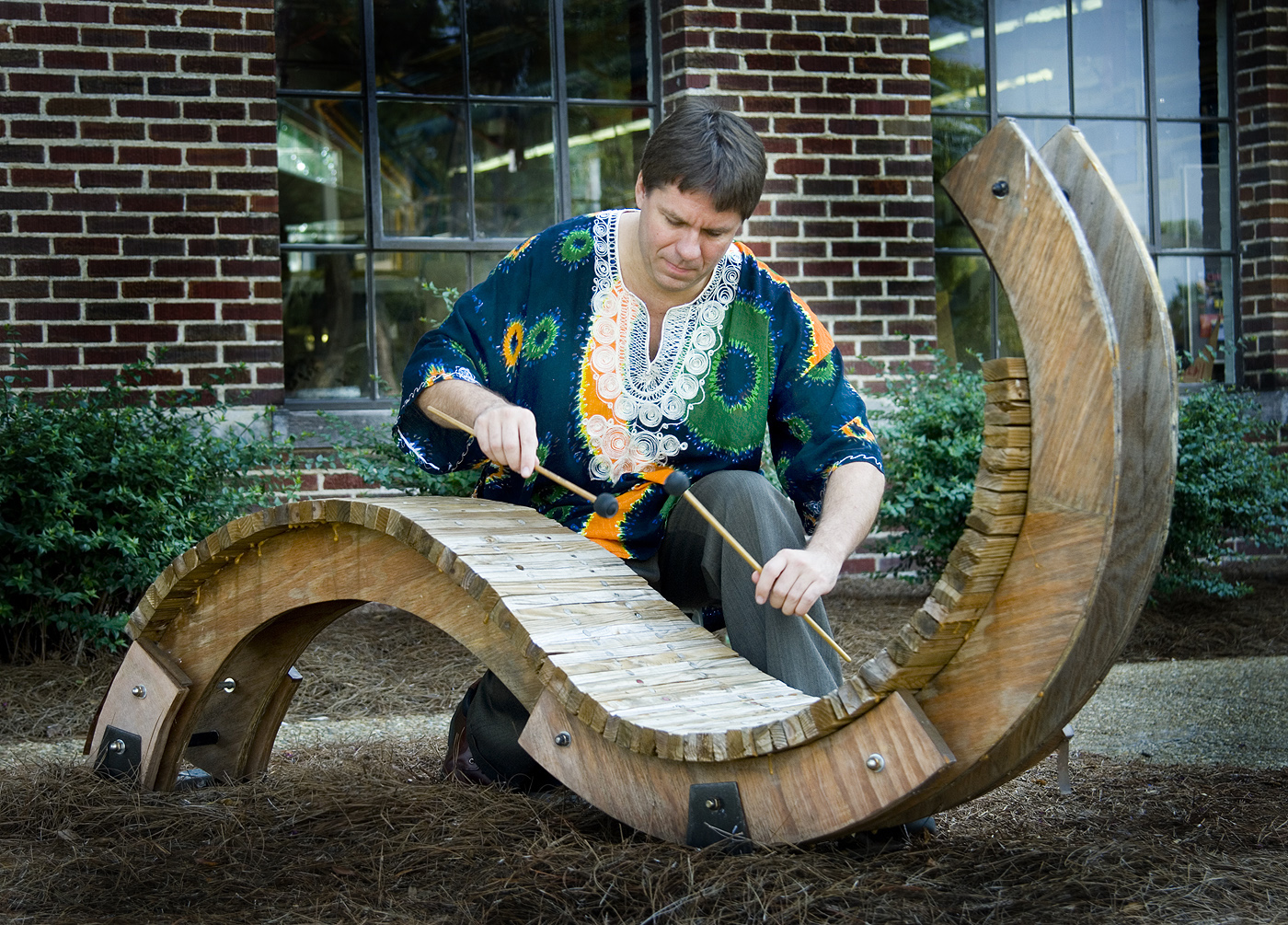 MSU percussionist Robert Damm pretends to play a sculpted version of a marimba. MSU percussionist Robert Damm pretends to play a sculpted version of a marimba.