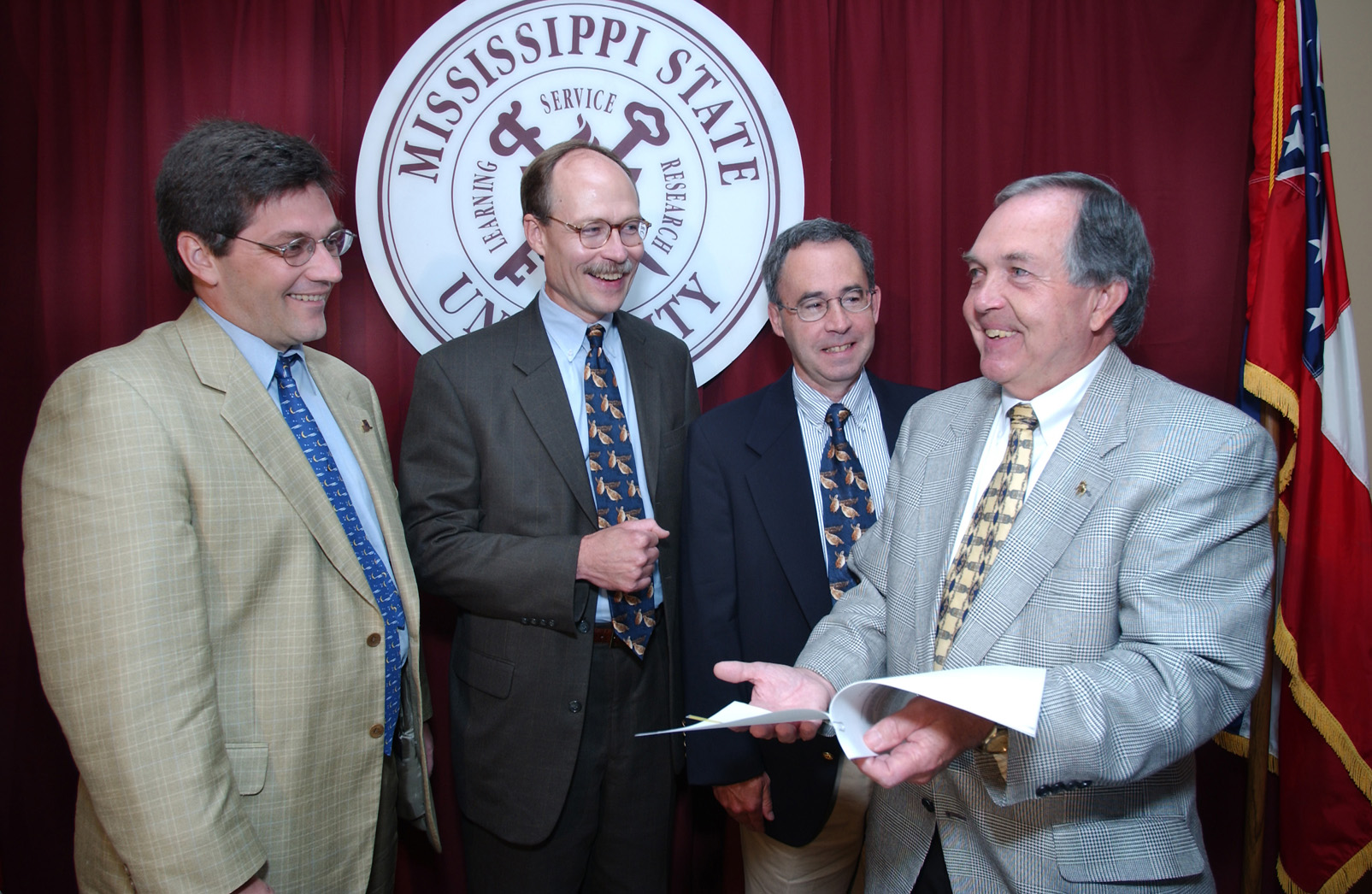 <br />
Commemorating the partnership were (l-r) Bruce Knight of the Natural Resources Conservation Center, Corky Pugh of the Southeastern Association of Fish and Wildlife Agencies, Dave Howell of Quail Unlimited, and Vance Watson, MSU interim vice president of agriculture, forestry and veterinary medicine.   