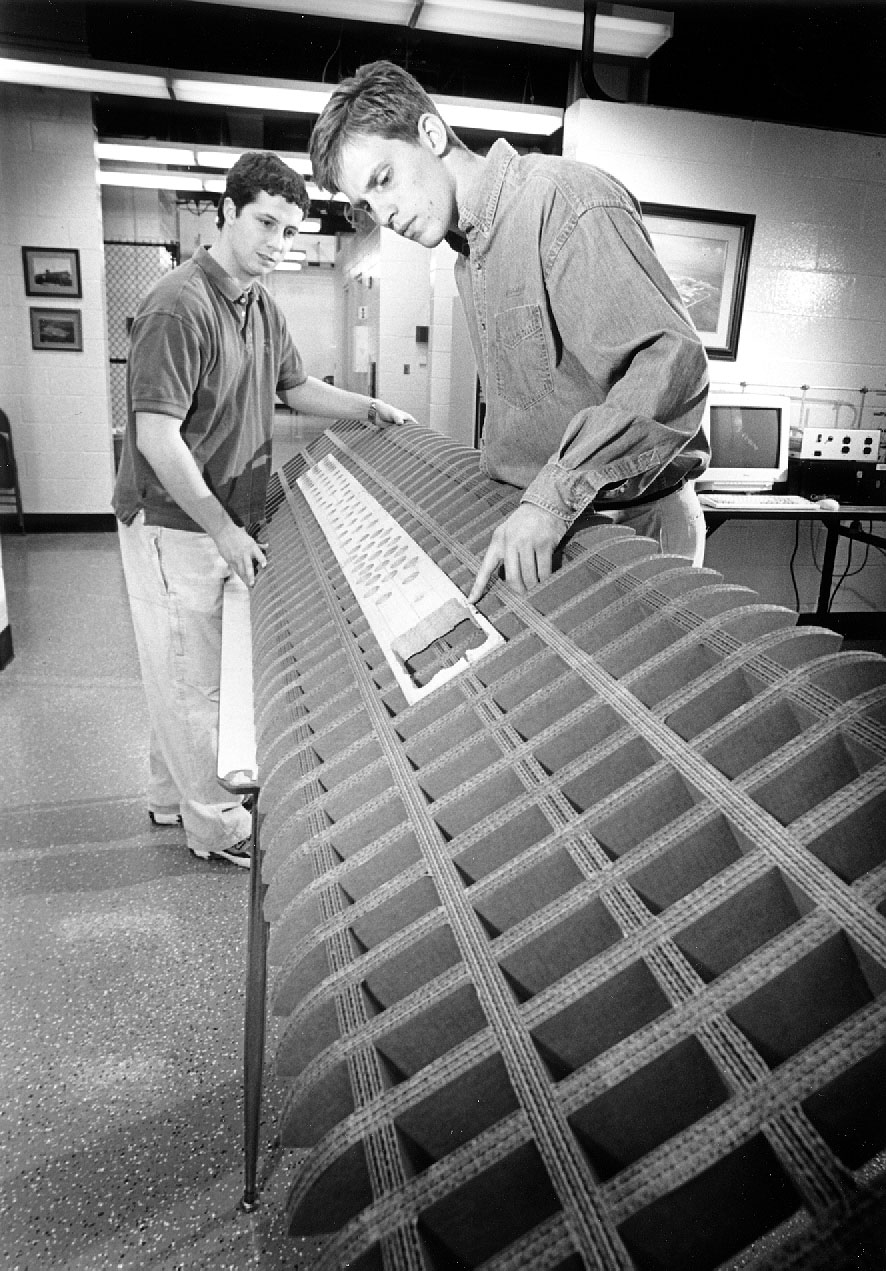 <br /><br />
MSU students Andrew Queen of Baton Rouge, La., (r) and Scott Junkin of Hanceville, Ala., put the finishing touches on the cardboard sailboard. <br /><br />
MSU students Andrew Queen of Baton Rouge, La., (r) and Scott Junkin of Hanceville, Ala., put the finishing touches on the cardboard sailboard.