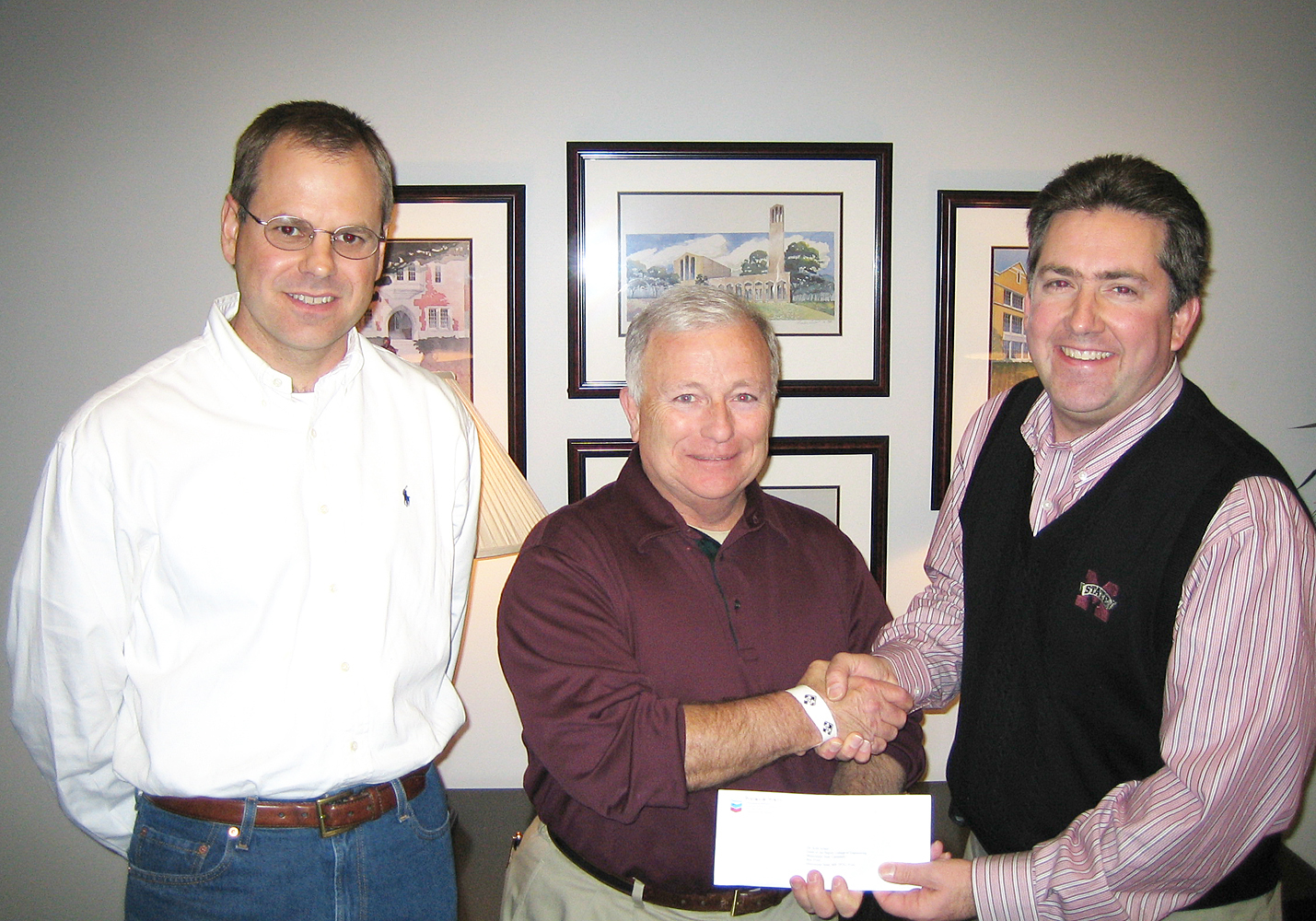 Steve Renfroe, center, public and government affairs manager for Chevron Corp.'s Pascagoula refinery, recently presented a $60,000 check to Kirk Schulz, right, dean of MSU's Bagley College of Engineering, for a variety of departments and programs within the college. Also on hand for the presentation was Blake Hudson, left, development director for the college. Steve Renfroe, center, public and government affairs manager for Chevron Corp.'s Pascagoula refinery, recently presented a $60,000 check to Kirk Schulz, right, dean of MSU's Bagley College of Engineering, for a variety of departments and programs within the college. Also on hand for the presentation was Blake Hudson, left, development director for the college.