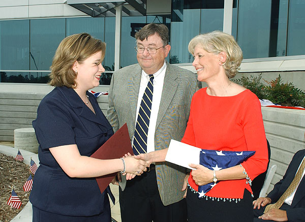 <br /><br />
Jennifer Jennings (l), MSU's first Jerry Dickerson Memorial Scholar, is congratulated by Dickerson's widow, Page, and President Charles Lee. <br /><br />
Jennifer Jennings (l), MSU's first Jerry Dickerson Memorial Scholar, is congratulated by Dickerson's widow, Page, and President Charles Lee.