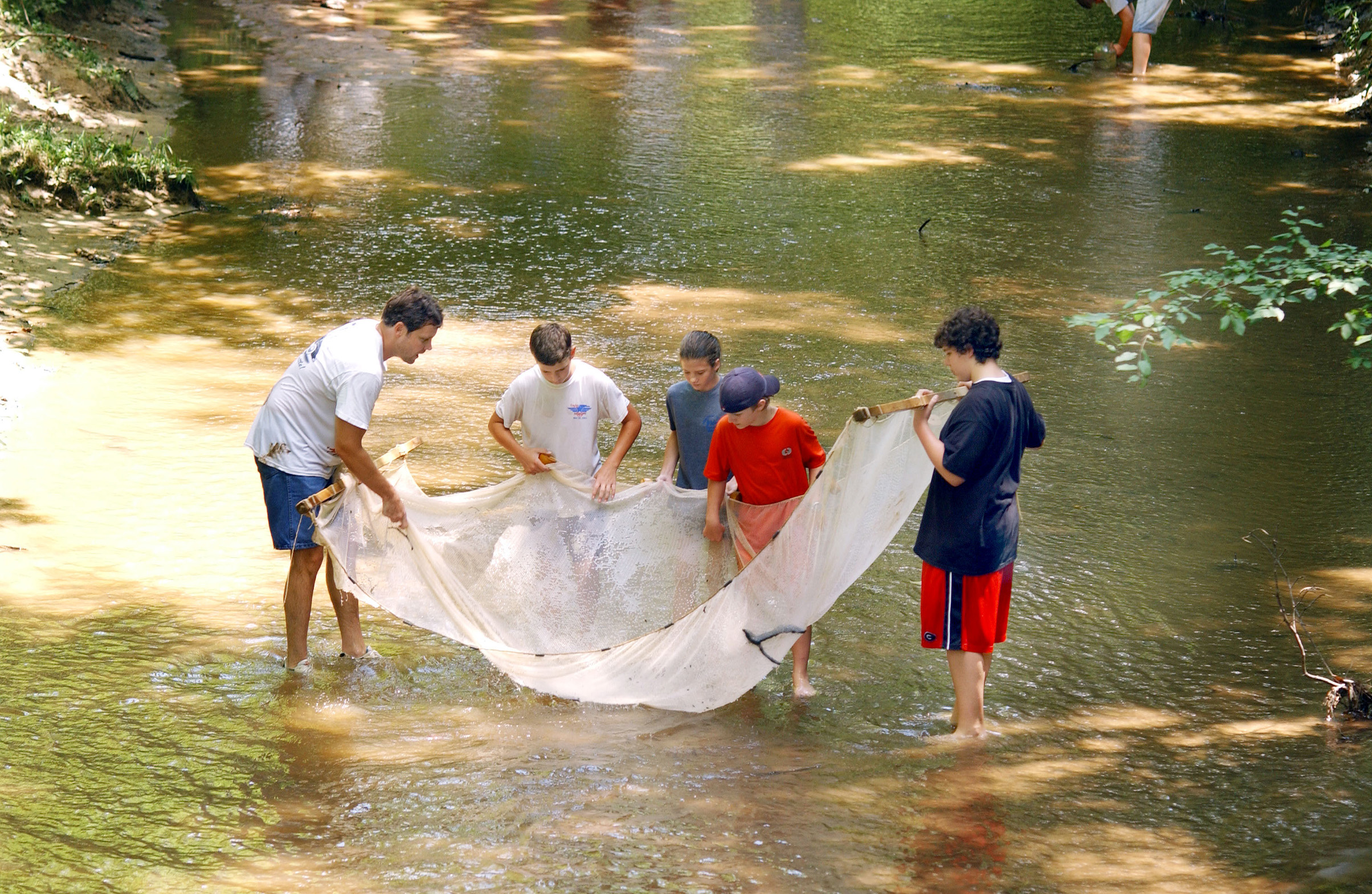 <br /><br />
MSU biological scientist Chris Taylor discusses stream ecology with CREST students (second from left to right) Alex Rowe, Kate Henson, Reed Chandler, and David Hatcher. <br /><br />
MSU biological scientist Chris Taylor discusses stream ecology with CREST students (second from left to right) Alex Rowe, Kate Henson, Reed Chandler, and David Hatcher.