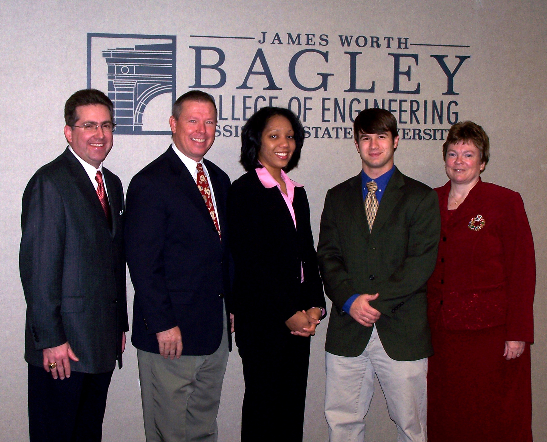 Graduating engineering students Christina Smith of Greenwood and Norman Cruse of Okolona (third and fourth from the left) are the latest recipients of the Jack Hatcher Entrepreneurship Certificates through a university program that promotes careeers combining technical and business skills. Joining them for a recognition ceremony were (from left) Kirk H. Schulz, dean of the Bagley College of Engineering; Gerald Nelson, Hatcher Chair and director of the college's entrepreneurship program; and Donna Reese, associate engineering dean for academics and administration. Graduating engineering students Christina Smith of Greenwood and Norman Cruse of Okolona (third and fourth from the left) are the latest recipients of the Jack Hatcher Entrepreneurship Certificates through a university program that promotes careeers combining technical and business skills. Joining them for a recognition ceremony were (from left) Kirk H. Schulz, dean of the Bagley College of Engineering; Gerald Nelson, Hatcher Chair and director of the college's entrepreneurship program; and Donna Reese, associate engineering dean for academics and administration.