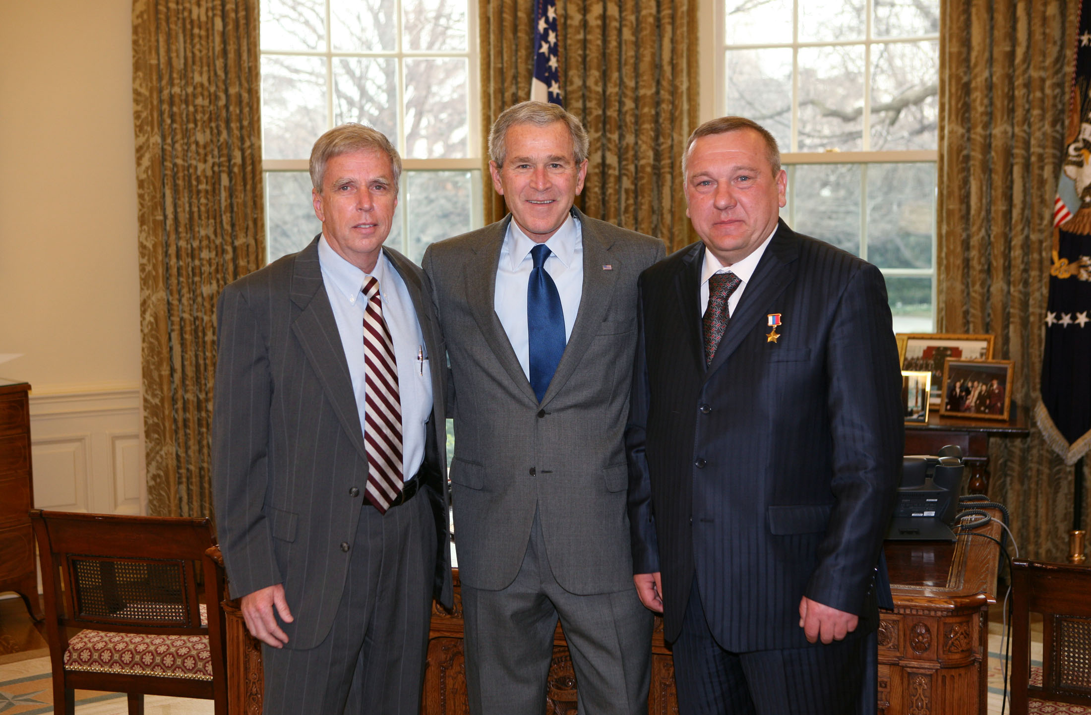 (Left) MSU President Robert H. "Doc" Foglesong, President Bush, and Gen. Vladimir Shamanov (Left) MSU President Robert H. "Doc" Foglesong, President Bush, and Gen. Vladimir Shamanov